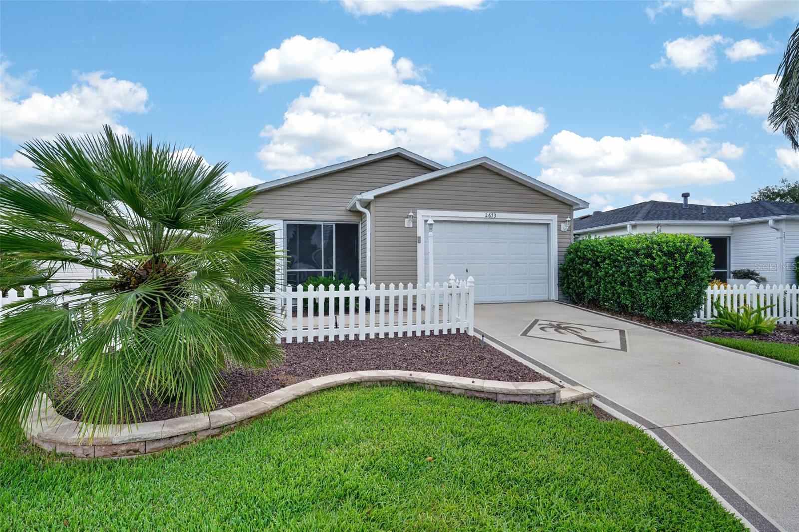 Enjoy the ease of Florida living in this FABULOUS, BOND PAID, TURNKEY 2/2 Colony Patio Villa featuring a Massive Back Yard (Think Pool, SPA, Firepit) that few Villas have in The Villages. - IDEALLY LOCATED in the highly sought after Village of BELVEDERE! As you arrive at this METICULOUSLY-MAINTAINED home, you are immediately greeted by its CHARMING picket fence, DECORATIVELY PAINTED drive and walkways, and recently updated, LOW MAINTENANCE stone and mulched landscaping beds. From the patio, step into the Enclosed lanai, complete with a ceiling fan and Tiled floor, creating an inviting space to enjoy your morning coffee, unwind with an evening cocktail, or settle in with a good book. The new ROOF and Garage Door in 2020 provide Security and protection. Throughout the home, you’ll find GORGEOUS, WOOD Laminate flooring - NO CARPET! Two LARGE windows and French Glass glass doors in the living and dining areas flood the space with an ABUNDANCE of NATURAL LIGHT, enhancing the home’s warm and inviting feel. The kitchen features WOOD cabinetry with Newer STAINLESS steel appliances, a PANTRY closet, and an EAT-IN breakfast bar - ideal for casual dining and entertaining. The primary suite boasts VAULTED ceilings, a generous WALK-IN closet, and a well-appointed en-suite bathroom with WOOD cabinetry, NEUTRAL countertops, and a MODERN WALK-IN shower. Bedroom two also offers a VAULTED ceiling and built-in closet. The second bathroom includes a WOOD vanity with NEUTRAL countertop, a tub and shower combination, and a hall LINEN closet. Completing this IMPRESSIVE home is an 18’ x 22’ one-and-a-half-car garage featuring EPOXIED floors and AMPLE space for both a vehicle and golf cart! DON’T MISS YOUR OPPORTUNITY TO MAKE THIS WONDERFUL VILLA YOUR OWN! The Village of Belvedere is IDEALLY LOCATED 1.5 mile to Lake Sumter Landing with Shopping, Dining, and Live Nightly Entertainment! CR 466 offers a Publix Supermarket, Fresh Market, Costco, Banking & Shopping for your convivence.  Belmont, Churchill & Pimlico Executive Golf Courses are close to the Villa; PLEASE WATCH OUR WALKTHROUGH VIDEO of this INCREDIBLE HOME and call today to schedule your Private Showing or Virtual Tour! 2020 YAMAHA 2 SEATER GOLF CART LOW MILES AVAILABLE SEPERATLY...