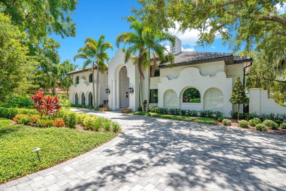 Welcome to one of the most exquisite golf front estates within the main gates of Isleworth. Just a short distance from the prestigious Isleworth Golf & Country Club you will find a distinctive masterpiece that has the most amazing views of the golf course and The Butler Chain of Lakes. It is unique and rare to find a home with no neighbors on three sides. It gives you this great sense of privacy that can only be appreciated from this extraordinary property. This custom residence underwent a spare no expense remodel by McNally Construction and design by Debby Dearth of McNally Design in 2023 using the highest quality materials combining the latest designs with timeless Mediterranean architecture. The foyer leads to a living room adorned with basket weaved marble and wood flooring, 20’ ceilings complimented by wood beams, stone gas fireplace, and absolutely stunning views. The well-appointed chef’s kitchen is fully equipped with a large center island, custom wood cabinetry, Italian dolomite counter tops, Sub Zero refrigerator, and a Wolf gas range with griddle. The cocktail bar is adjacent to the kitchen and includes Cristallo quartzite counters and a temperature-controlled wine cellar that can easily accommodate 700+ bottles of wine. The family room boasts soaring vaulted ceilings with reclaimed solid wood floors and windows that flood the room with natural light. The main level master suite is spacious with impressive ceiling accoutrements, chandelier, large two-story walk in closet, spa like bathroom including a breakfast bar with a Sub Zero refrigerator, dual vanities, garden tub, glass shower, and French doors leading you to your well manicured grounds. Secondary bedrooms are all en-suites & generously sized. Relax in delight from your own theater room equipped with a projector, screen, and surround sound. This palatial mansion is located on the 2nd and 9th tees of the Isleworth championship golf course with almost 300 feet of golf frontage giving this magnificent residence amazing views of Lake Chase with a total sense of privacy. Exterior living spaces features a large covered lanai, heated salt pool, full pool bath, summer kitchen with stainless steel grill, sink, beverage refrigerator, and custom built stacked stone outdoor fireplace that makes it the perfect for entertaining or just enjoying the cool lake breezes. Notable upgrades done in 2023 include a brand new tile roof, replacement of all custom doors and windows, remodeled kitchen, bathrooms with Kohler fixtures, door hardware, cocktail bar, flooring, Control 4 smart house features for lighting, electric shades, cameras, HVAC, pool equipment, garage doors, locks, built-in sound system, pool resurface, new pool heater, landscaping, complete interior and exterior paint, and exterior gray pavers. The timeless architecture with its stately well balanced curb appeal shows an unparalleled attention to details on quality and perfection throughout. Here is your once in a lifetime opportunity to own an exclusive residence combining both lake and golf lifestyles. Be sure to click on the virtual tour links.

<iframe width='853' height='480' src=https://my.matterport.com/show/?m=pmh1hwNxnW3&mls=1
></iframe>