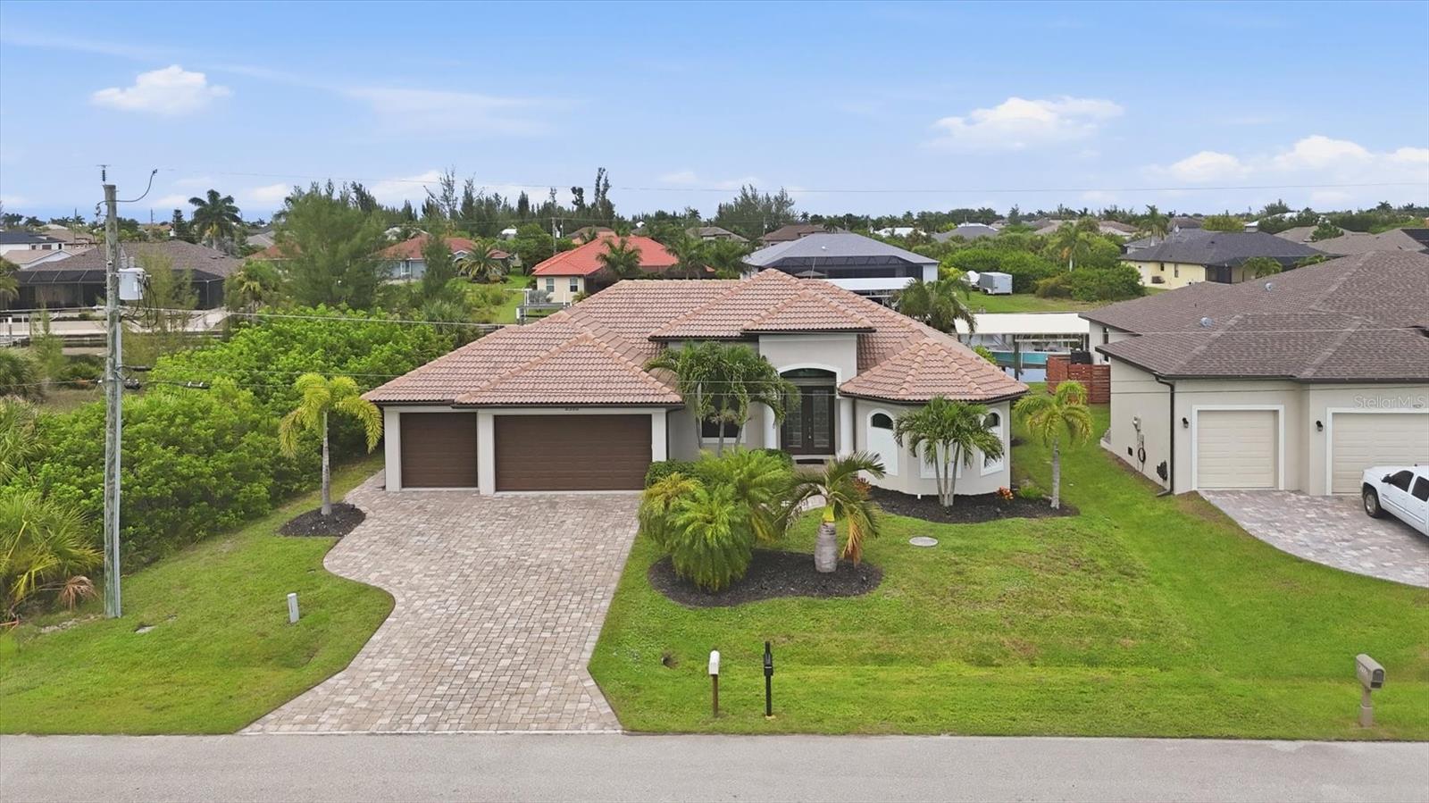 Experience exceptional WATERFRONT LIVING in this stunning CUSTOM-BUILT DM DEAN HOME offering breathtaking wide canal views and GULF ACCESS in the highly desirable boating community of South Gulf Cove. From the moment you arrive, the beautifully landscaped grounds, elegant PAVER DRIVEWAY, TILE ROOF, and impressive curb appeal set the stage for the quality and craftsmanship found throughout this remarkable residence.

Designed with both luxury and functionality in mind, this thoughtfully designed split floor plan features 3 spacious bedrooms PLUS OFFICE/DEN, an open-concept layout filled with natural light, and beautiful Wood-Look Tile Flooring throughout. Elegant tray ceilings, tasteful finishes, and expansive 90-DEGREE IMPACT SLIDING GLASS DOORS create a seamless transition between indoor and outdoor living while showcasing stunning views of the pool and canal.

The chef-inspired kitchen is sure to impress with abundant white cabinetry, luxury granite countertops, designer tile backsplash, stainless steel appliances, bar seating, and a bright eat-in dining area perfect for entertaining family and friends. Nearly every room captures picturesque views of the HEATED POOL AND WATERFRONT, creating a true Florida retreat.

The spacious primary suite offers private lanai access, dual walk-in closets, and a spa-like ensuite featuring dual vanities and an oversized walk-through shower.

Step outside to your own tropical oasis where the expansive screened lanai and heated pool overlook a wide Gulf access canal, providing the perfect setting for relaxing, entertaining, or enjoying spectacular Florida sunsets. This BOATER'S DREAM features a CONCRETE SEAWALL, DOCK, AND PILINGS READY FOR A FUTURE BOAT LIFT.

Additional highlights include a 3-CAR GARAGE, IMPACT WINDOWS AND DOORS THROUGHOUT, SPRAY-FOAM INSULATION, plumbing in place for outdoor kitchen, exceptional craftsmanship, and meticulous attention to detail!

Enjoy all that South Gulf Cove has to offer, a waterfront community with a voluntary property owners association and a lock system providing boating access to Charlotte Harbor and the Gulf. Conveniently located just minutes from the pristine beaches of Manasota Key and Boca Grande, as well as golf courses, shopping, dining, grocery stores, schools, and everyday conveniences, this exceptional waterfront home truly offers the best of the Southwest Florida lifestyle.

Schedule your private showing today and experience everything this remarkable waterfront property has to offer.