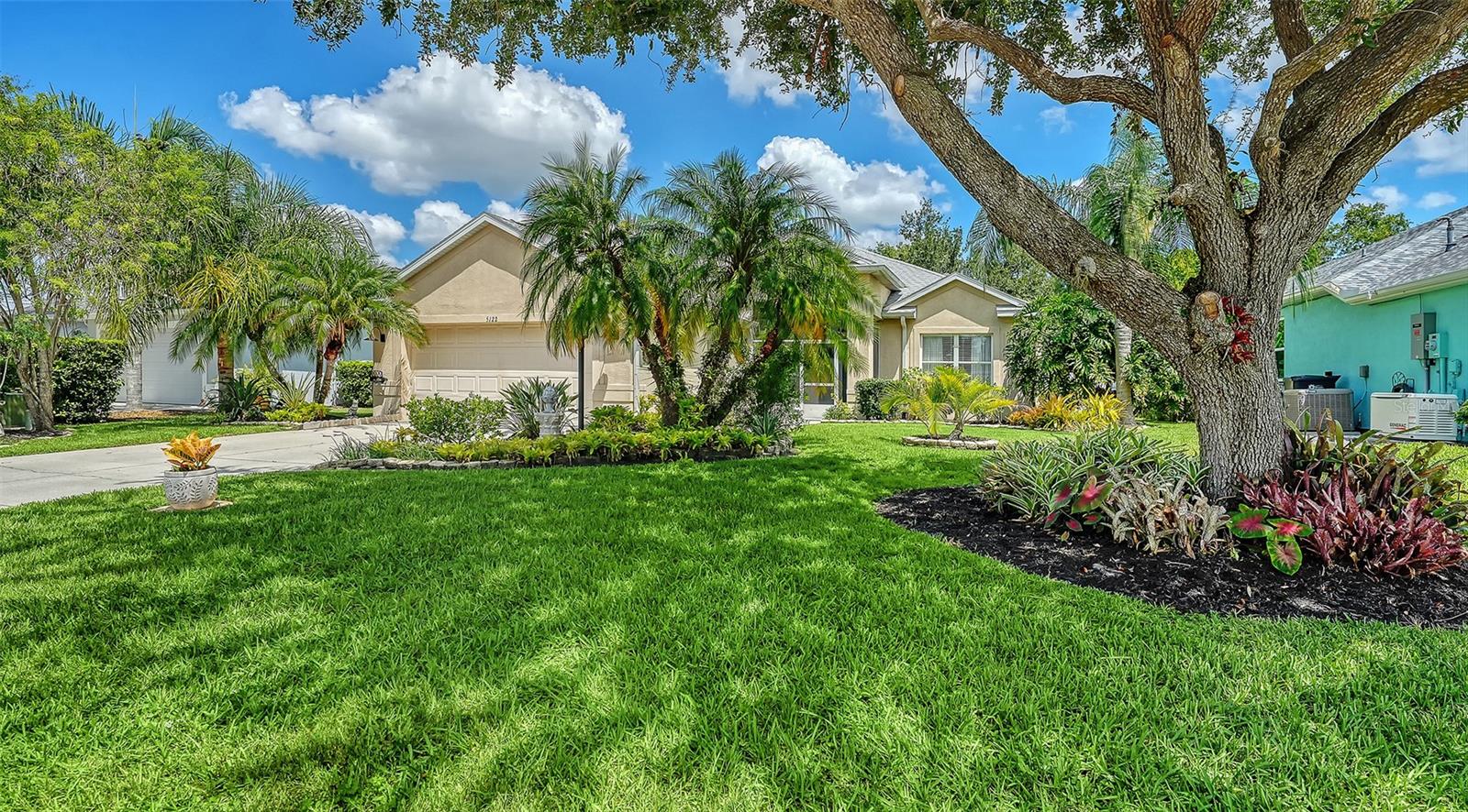 Welcome to Carlyle at The Villages of Palm-Aire, a highly sought-after, peaceful community in North Sarasota near Palm Aire Golf & Country Club. This beautifully updated 3-bedroom, 2-bath home is offering 1,807 square feet of open concept living space. The stunning kitchen is designed for chef-styled cooking.  You’ll love the granite countertops, breakfast bar, spacious island with added storage, eat-in dining area, custom cabinetry, a five-burner GE GAS cooktop, GE Profile built-in convection and microwave ovens, a Broan range hood, and new KitchenAid stainless-steel refrigerator and dishwasher.  The cabinets boast a Lazy Susan, glass front doors and a roll-out trash cabinet.  Glass-paneled French doors lead to the formal dining room.  The open concept floor plan of this home is enhanced by the 12 foot ceiling in the living room. Enjoy the split bedroom layout providing privacy for guests and families.  The primary suite features dual vanities, modern lighting, a soaking tub, separate shower, and custom walk-in closet. The guest bathroom has access to the lanai for convenience.  The spacious two-car garage is conveniently located just off the laundry room accessible from the kitchen.  Laundry day will be stress free with the new LG ThinQ washer and dryer. And, there’s plenty of cabinetry in the laundry room to hide everything! Don’t miss the air conditioned bonus storage room accessible in the garage!  When you’re all done at the end of the day, you’ll look forward to spending time on your quiet, peaceful and private covered lanai while listening to the fountain pond.  The back yard is enclosed with a vinyl privacy fence which backs to a preserve area.  Updates include a new 2026 gas water heater, 2025 roof, new stainless kitchen appliances, updated landscaping and new interior paint.  Seller includes 3 flat screen televisions in this sale.  Community amenities include a pool, pickleball and tennis courts, and a playground. Conveniently located near University Parkway and UTC Mall, the home is minutes from downtown Sarasota, St. Armands Circle, world-class Gulf Coast beaches, and Sarasota-Bradenton International Airport.