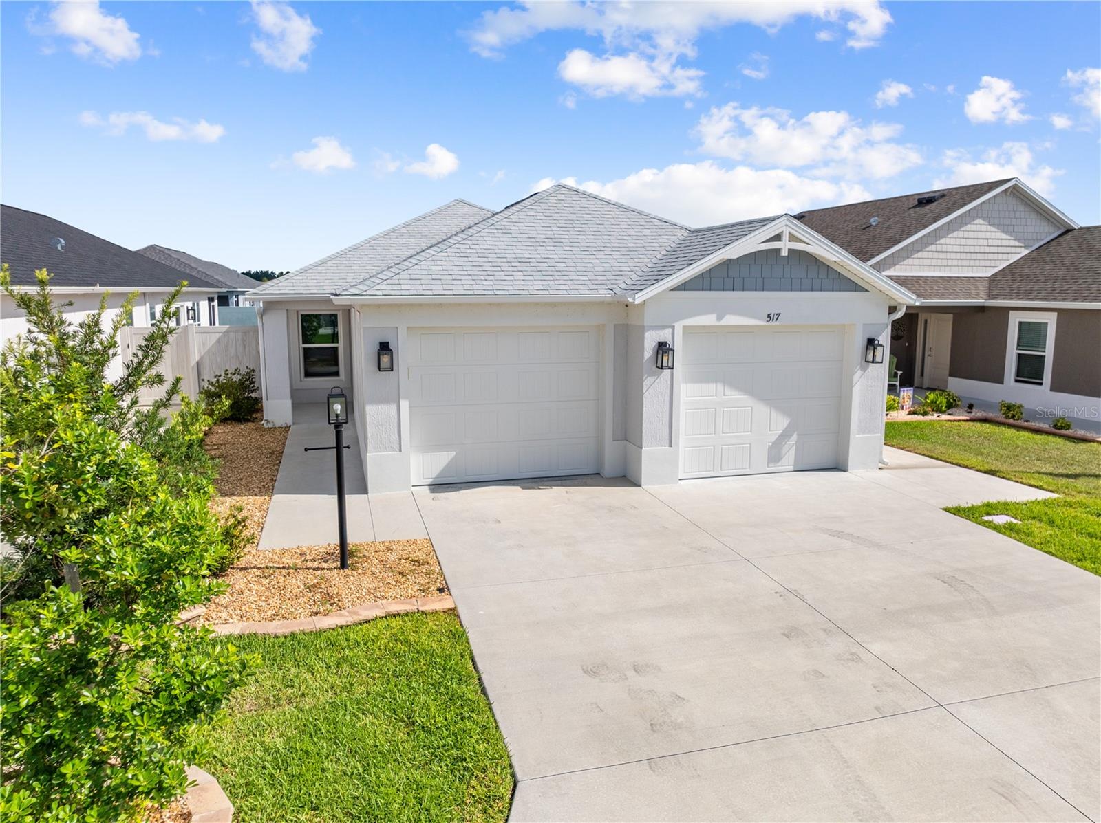 Welcome to 517 Lamington Lane in The Villages, Florida! Built in 2023, this beautifully maintained 3-bedroom, 2-bathroom single-family home with a 2-car garage offers the perfect blend of modern comfort, low-maintenance living, and the unparalleled lifestyle that has made The Villages one of Florida's premier 55+ active adult communities.
Step inside to discover a bright, open-concept floor plan designed for effortless entertaining and everyday living. Enjoy the peace of mind that comes with newer construction while embracing a home that's move-in ready from day one.
Living in The Villages means so much more than owning a beautiful home—it's a lifestyle! Residents enjoy access to an incredible selection of recreation centers, championship and executive golf courses, resort-style and neighborhood pools, pickleball and tennis courts, walking and biking trails, fitness centers, arts and crafts, and thousands of clubs and organized activities to match every interest. Free nightly live entertainment at the community's vibrant town squares, along with outstanding dining, shopping, and year-round events, creates an unmatched sense of community and fun. The community features multiple regional, village, and neighborhood recreation centers offering amenities ranging from sports pools and pickleball courts to theaters, arts and crafts rooms, billiards, and fitness spaces.
Whether you're searching for your full-time Florida residence or the perfect seasonal retreat, 517 Lamington Lane offers the opportunity to enjoy resort-style living every single day. Don't miss your chance to own a newer home in one of the nation's most sought-after active adult communities!