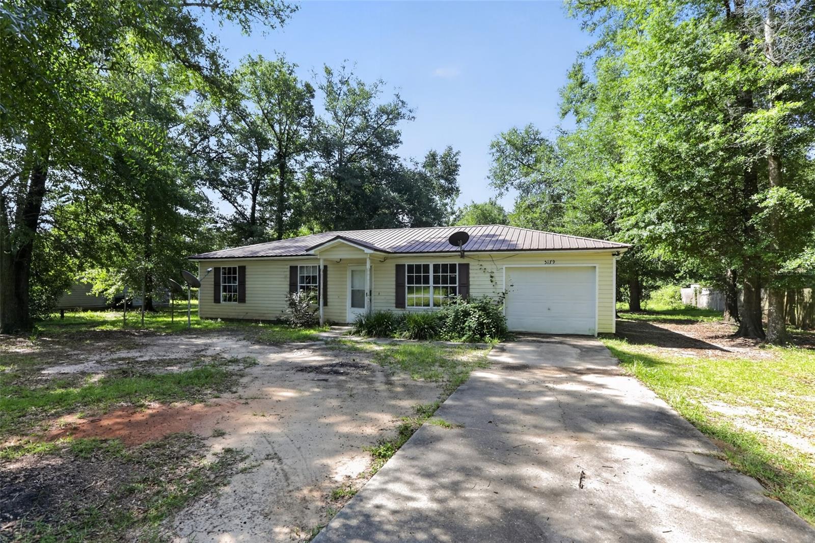 Welcome to your next opportunity in Greenwood! Situated on a spacious half-acre lot, this 3-bedroom, 2-bath home provides the perfect combination of comfort, functionality, and value. Whether you're a first-time homebuyer, downsizing, searching for an investment property, or simply looking for a place to make your own, this home is ready to fit a variety of lifestyles. Inside, you'll find a desirable split-bedroom floor plan, an open living and dining area, and durable tile flooring throughout for easy maintenance. The spacious kitchen provides ample cabinet and counter space, making meal preparation and entertaining a breeze. The primary suite includes a private bath, while two additional bedrooms and a full guest bath provide flexibility for family, guests, or a home office. The attached garage provides additional storage and convenience, while the generous yard creates endless possibilities for gardening, outdoor entertaining, pets, or future improvements. With solid bones and plenty of potential to personalize, this property presents an excellent opportunity for buyers using financing or cash. Conveniently located with easy access to nearby schools, parks, and everyday amenities, this home provides the space and flexibility you've been searching for.  
Schedule your private showing today and discover all the possibilities this Greenwood property has to provide!