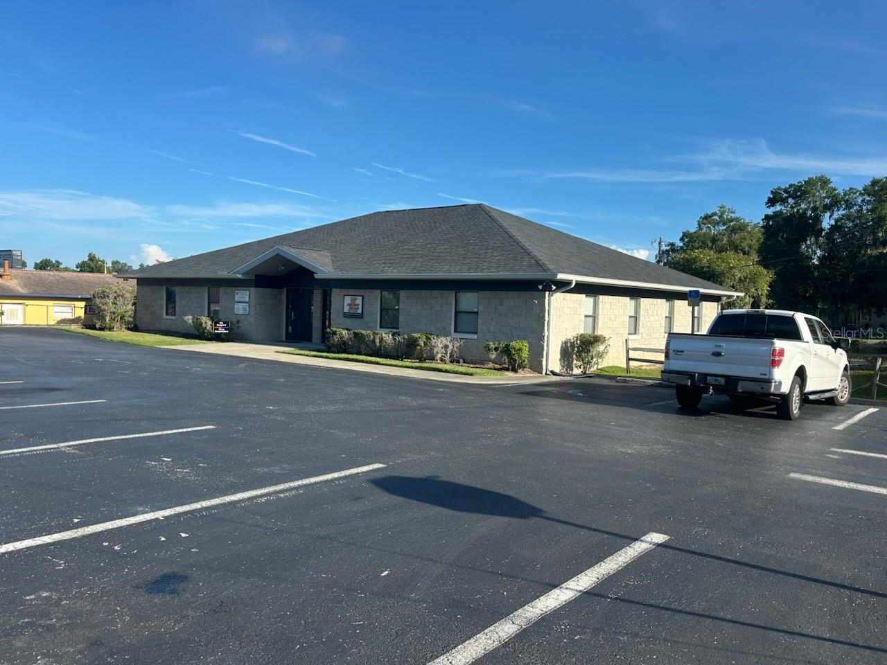 Exceptional Investment or Owner/User Opportunity!  Properties like this are a rarity in this location - this well positioned office building in the heart of Downtown Ocala is a must see!  This fully leased 3,444 SF property sits on a .29-acre parcel with highly flexible FBC Zoning, allowing for a wide range of uses.  The building is divided into two units:  Unit 1 features multiple individual office suites with established tenants under lease, while Unit 2 is currently occupied on a month-to-month basis — ideal for an owner needing immediate space or for securing a new long-term tenant.  Positioned for maximum convenience, this property offers excellent access from both Pine Avenue and downtown streets, and is just minutes from Ocala’s premier amenities, including medical services, dining, shopping, and professional resources.  A new roof installed in 2024 provides added peace of mind, and the building has been meticulously maintained.  This is a prime opportunity for investors or owner-occupants looking to secure a premium downtown location with built-in income.