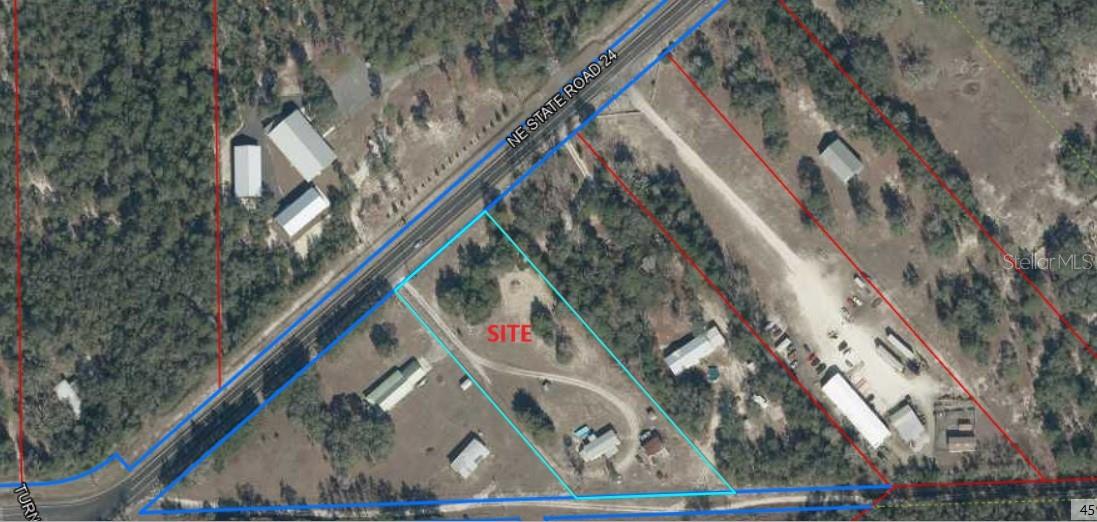 Commercial property located on a main State Road through Bronson Florida.  The property zoning will allow warehouses including offices and showrooms, retail spaces 15,000 square feet or less (Dollar General, Family Dollar, Dollar Tree), Self-Storage, Restaurants, Personal Services, and Adult and Child Care Facilities.   The property has a manufactured (mobile) home on the rear of the property allowing for a great live working environment.