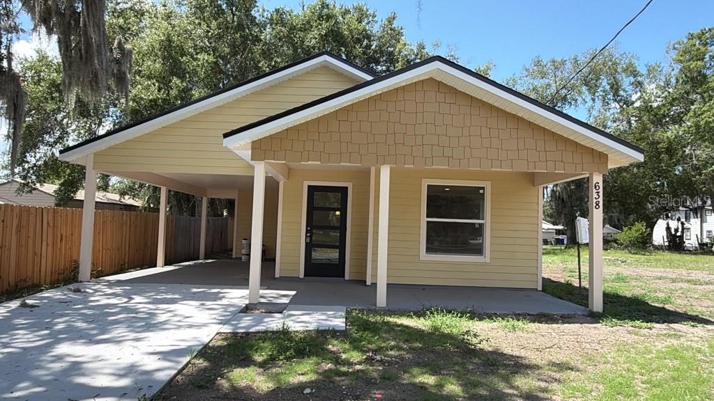 NO HOA! BRAND NEW 2026 CONSTRUCTION! MOVE-IN READY! This stunning 3-bedroom, 2-bathroom single-family home at 638 W 7th Street, Lakeland offers a thoughtfully designed open floorplan with modern finishes and quality craftsmanship throughout. Situated on a centrally located lot within Lakeland city limits in Flood Zone X, this home provides the perfect combination of convenience, functionality, and low-maintenance living. Built with durable concrete and wood-frame construction and connected to public water and public sewer, this home is designed for today's lifestyle. Enjoy luxury vinyl flooring, soaring ceilings, solid wood cabinetry, stone countertops, walk-in closets, ceiling fans, and an open kitchen overlooking the main living area. The spacious covered front porch and oversized 2-car attached carport provide additional outdoor living and ample parking. No HOA means the freedom to enjoy your property without restrictive association rules or fees. Conveniently located just minutes from downtown Lakeland, Bonnet Springs Park, Lake Mirror, shopping, dining, schools, medical facilities, and I-4, offering easy commutes to both Tampa and Orlando. This is an excellent opportunity to secure a brand-new home at an affordable price. Seller financing and private financing available. Do NOT wait, it will not last long!