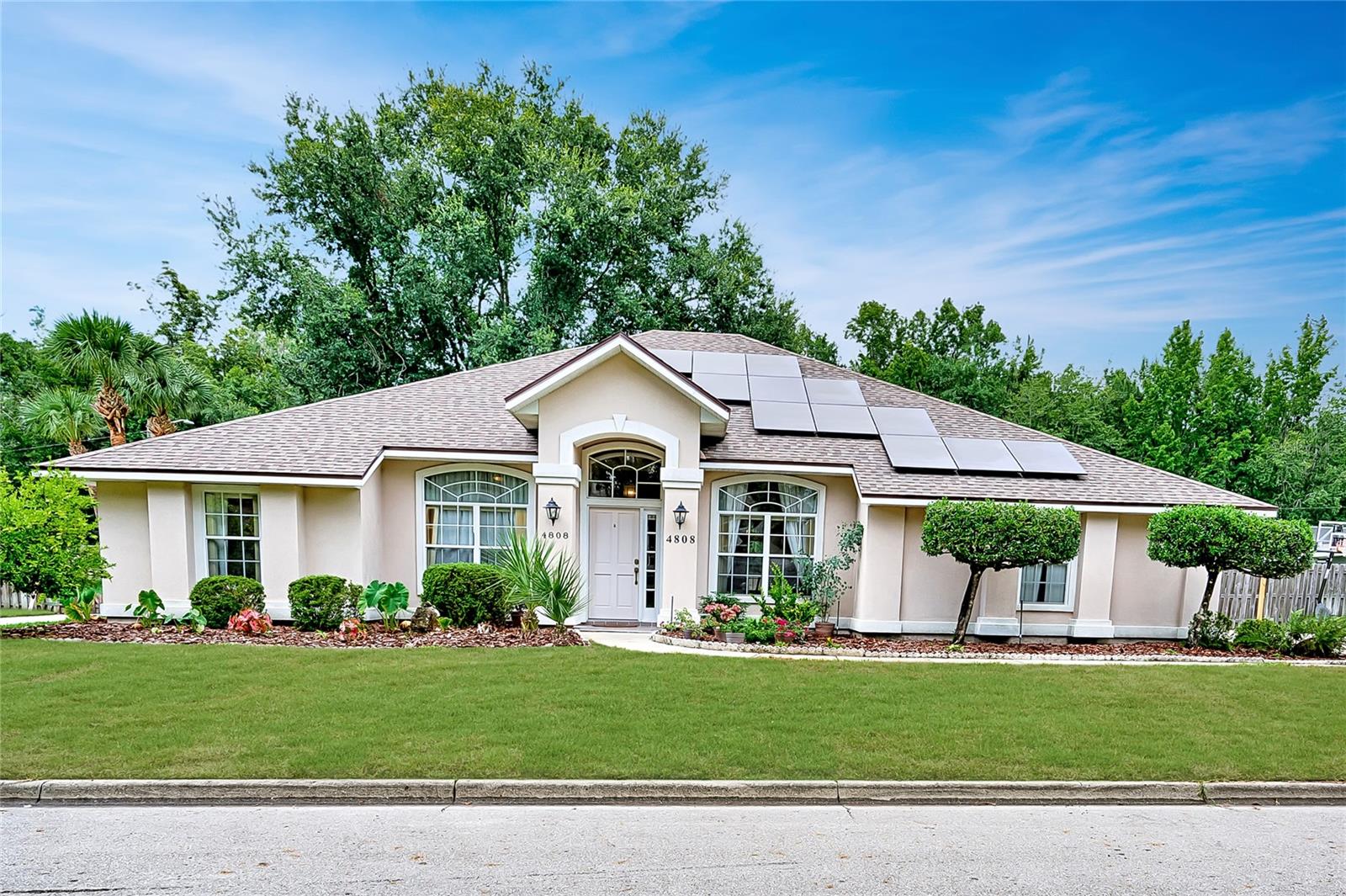 One or more photo(s) has been virtually staged. Beautiful 4 bedroom/2 bathroom home located in the sought after neighborhood, Sterling Place! This home has several upgrades such as, 2019 Roof w/ Solar, 2021 HVAC & 2022 Hot water heater! The formal dining room and formal living room, which is currently used as an office, flank the foyer. Every room in the house has an ethernet port. The functional split floor plan allows for plenty of privacy. The hall bathroom has been completely updated with new vanity, fixtures and shower. The eat-in kitchen has been recently renovated with quartz countertops, stainless steel appliances, gas range, built-in microwave and pantry. The primary bedroom features a walk-in closet and en-suite bathroom with two vanities, walk-in shower, garden tub and linen closet. The living room has French doors that open to the screened in patio. Backyard is spacious and perfect for gardening with irrigation already in place. Zoned for Talbot Elementary, Ft. Clarke Middle School and Gainesville High School. Conveniently located near UF, Shands, NFRMC, Progress Park, San Felasco State Park and Hunter's Crossing shopping and restaurants!
