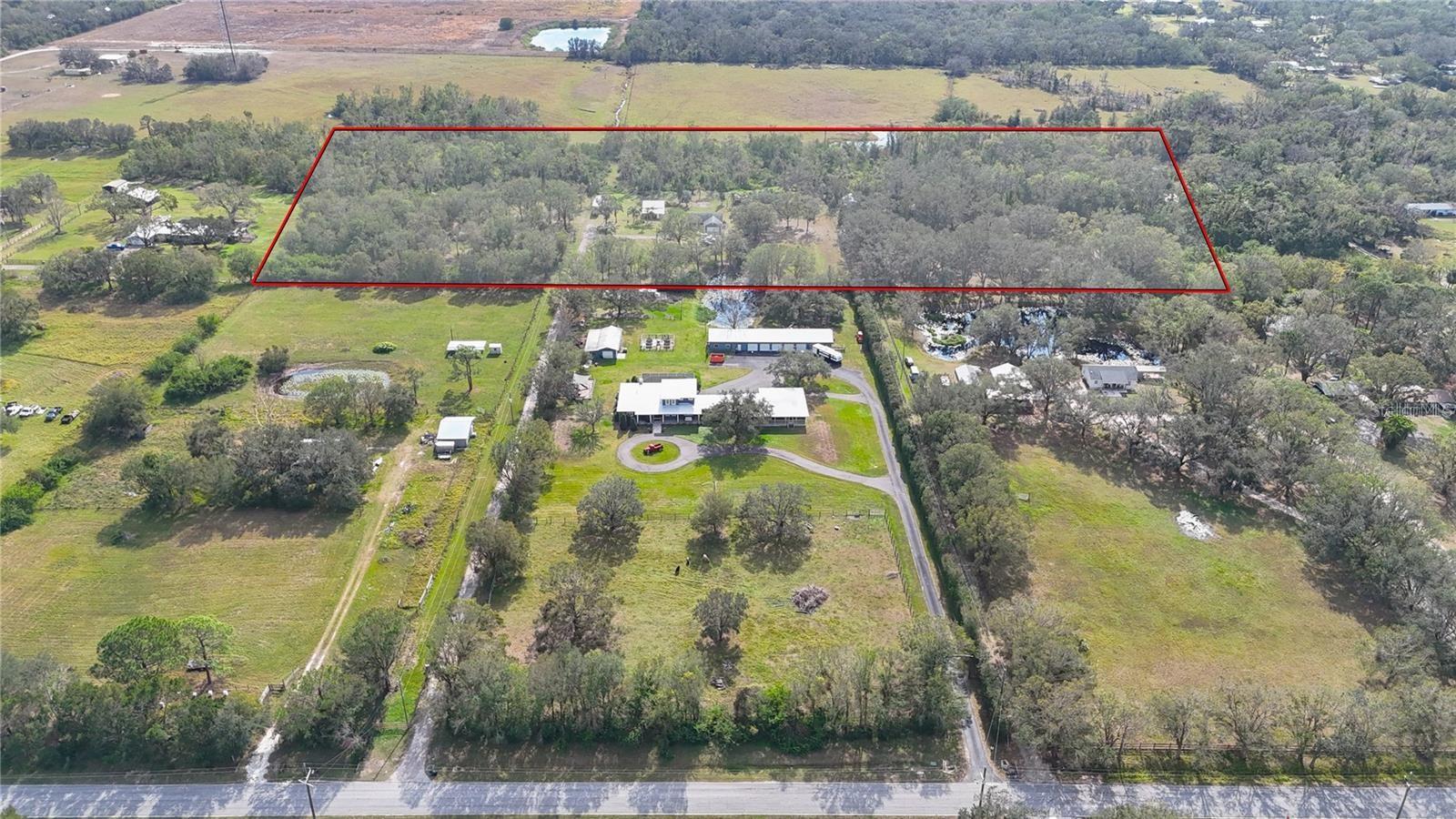 Available now: a rare 15.03-acre multi-use property spanning two parcels on highly desirable Waterline Road, located just minutes from the eastern expansion of Lakewood Ranch. Zoned Agricultural with absolutely no HOA or CDD restrictions, this fully cleared and landscaped site features mature oaks, walking trails, and creek access. A major competitive advantage is the existing turnkey infrastructure, including two established homes with well and septic, plus a workshop, offering immediate utility. With its expansive footprint and zoning flexibility, the site provides strategic, value-add potential for an equestrian facility, a sprawling custom family compound, or development. Positioned just 1.5 miles from everyday essentials with rapid access to SR 64 and I-75, this property delivers the premier Lakewood Ranch area lifestyle with the ultimate freedom of unrestricted acreage.