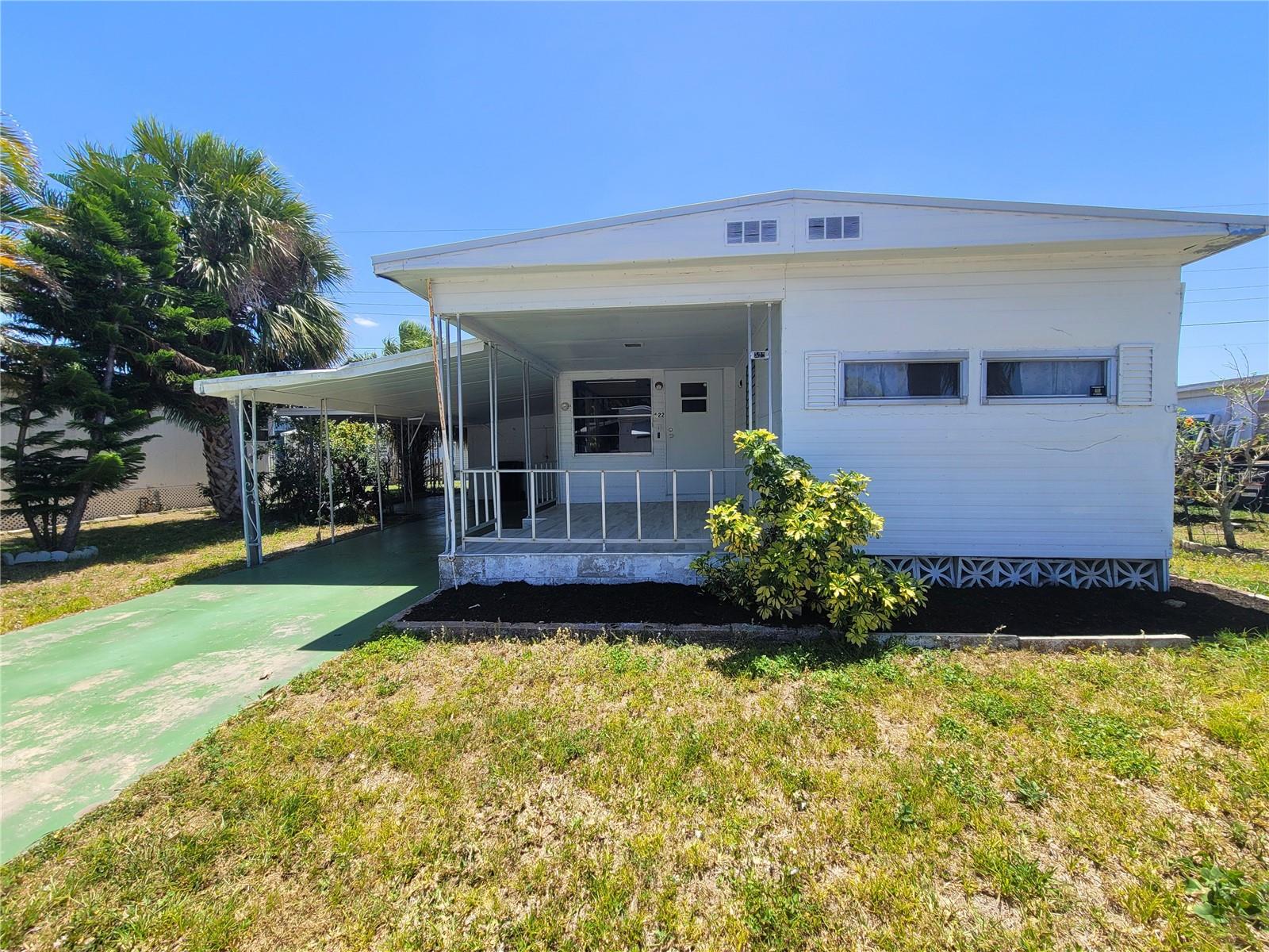 Step into your ideal Florida lifestyle with this delightful 2-bedroom, 2-bathroom home in FAIR LANE ACRES. Perfect as a year-round residence or a seasonal escape, this property is nestled within a vibrant, resident-owned 55+ community and offers exceptional value for those seeking sun and relaxation.  Fair Lane Acres is an active community offering excellent amenities, including a sparkling pool, tennis and pickleball courts, shuffleboard courts, and a clubhouse filled with activities and social opportunities. With low monthly fees of $138, covering common areas, pool maintenance, and sewer and water,