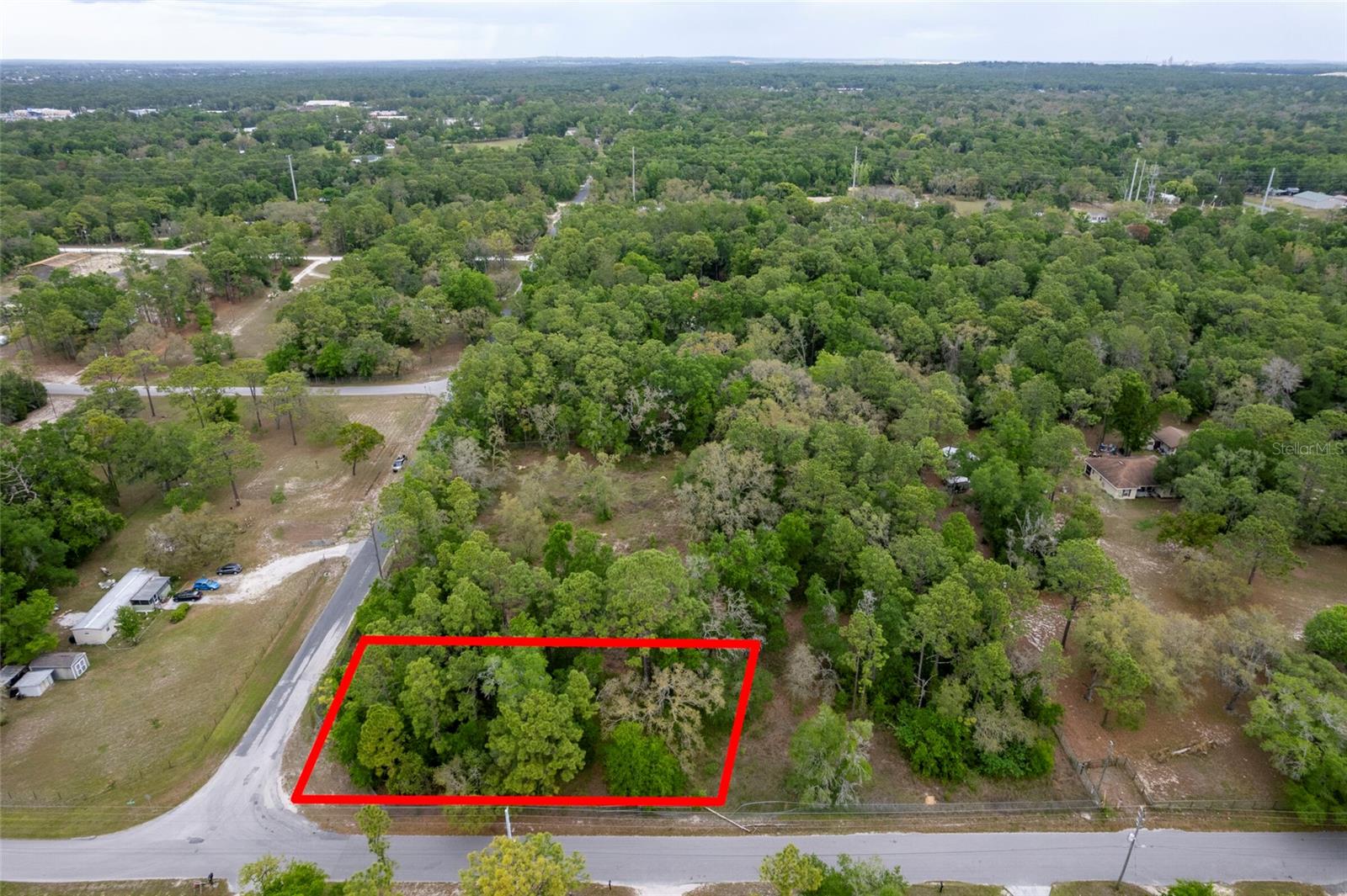 Build-ready corner lot opportunity on 1.3 acres in Brooksville! This residential homesite offers a major head start with well, septic, and electricity already on site—saving you time, money, and hassle compared to raw land. No flood insurance typically required, flood zone X. The property is partially fenced and provides the perfect canvas to build your dream home or place a new manufactured home with flexibility under AR zoning. Enjoy the freedom of country-style living with room for your vision, while still being conveniently located near major roads, shopping, and everyday essentials. Whether you’re looking to build now or invest for the future, this property offers endless potential without the typical development headaches.