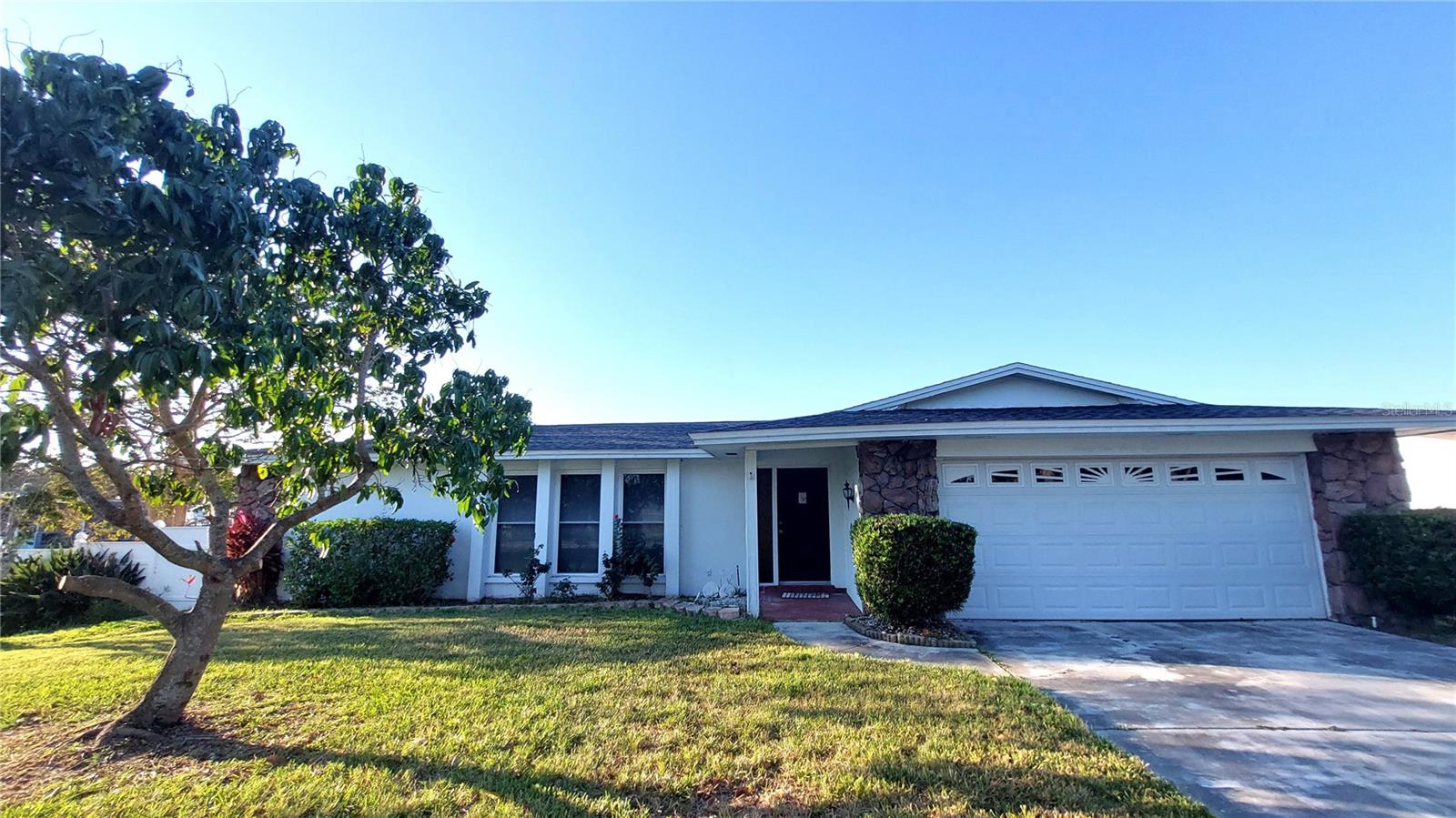 You can Short Term Rent this Home like Airbnb or other as long as you meet the Pinellas and City of Largo guidelines for Short Term Rental! The mailing address is Clearwater, but the site address is Largo. This WATERFRONT HOME comes with 4 Bedrooms, 2 Full Baths, 2 Car Garage, a large In-ground pool, and a spectacular 289 ft water frontage on Allen's Creek.  This home features a spacious split floor plan with separate living room and family room, dining room, kitchen, dinette and laundry room. A large home on a large lot lined with fruit trees, this home resembles an Oasis in a Great Location yet close to everything from shops to beaches. The owners had lived on this property since 1992 and had never experienced any flooding in the house.  Roof was replaced in 2019! Tile floors throughout the house with a Brick entryway. Newer double-pane windows, a 2-car garage with ample storage, a peaceful neighborhood, and easy access to downtown, local golf courses, and the sugar sands of Clearwater Beach. Great Home for boaters, or if you simply want the Florida lifestyle!