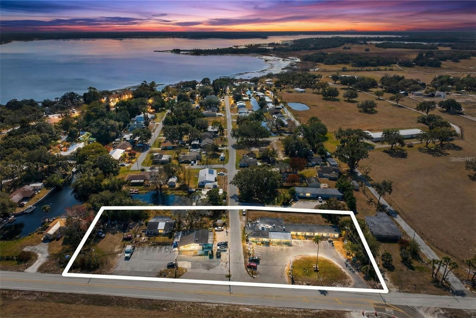 COMMERCIAL INVESTORS WANTED, Over 1.53 ACRES combined! Two Parcels. Three Income Streams. Can be bought as a whole, or individually. An Iconic Highway Presence, all positioned directly beside U.S. HIGHWAY 192 in the BOOMING city of St.Cloud Florida. With over 41,000+ vehicles per day (peaks exceeding 55,000), this high-visibility commercial offering includes the following; A Fully Equipped Convenience Store + 2BR/1BA Waterfront Residence, the Cozy Cove Motel and Bar (8-Unit Motel + Full Bar & Entertainment Venue)**All parcels are commercially zoned — no rezoning contingencies, no entitlement delays.
PARCEL ONE (CODE 1113): A Waterfront Convenience Store + Residential Unit. A long-standing draw in the St. Cloud / Osceola corridor for 55+ years, this established operation offers you a Fully equipped and stocked retail store, Commercial kitchen area, Walk-in freezers, Ample on-site parking, and Direct canal access at rear of property. But wait, there is more on this property than just the store. You have a canal/waterfront 2 Bedroom / 1 Bath residence. Both units have lake access to the Alligator Chain of Lake system.
A Unique differentiator with this property: patrons can arrive by boat directly from the lake system. There is no comparable retail/bar/motel combination in the immediate trade area with both highway frontage and navigable canal access. PARCEL TWO (CODE 3911): The Iconic Cozy Cove Motel & Bar. A recognized landmark along the 192 corridor, the Cozy Cove delivers immediate income and an entertainment upside.

The Bar & Venue Features the following;

Full liquor bar,

Commercial kitchen,

Walk-in freezers,

Dedicated office space,

DJ booth with surround sound, lighting system,

Pool table area

and an Established customer base.

The Motel Component has;

8 units with a Weekly rental model. They are currently Fully occupied.

This property is Income producing on Day One!

You may Maintain current operations for stable cash flow or reposition/redevelop to match your vision for the corridor’s continued growth.

Here are some Investment Highlights to consider;

Prime US-192 frontage

41K–55K VPD exposure,

Dual parcel flexibility,

Canal + lake system access,

Mixed-use income streams,

55+ year operating history,

Commercial zoning in place,

and Immediate cash flow,

This is not just a property — It is a generational roadside and waterfront landmark in one of Central Florida’s most traveled corridors.

Qualified buyers only please. Private showings by appointment.
Call directly to schedule your tour.