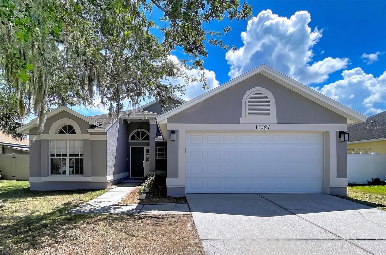 Virtually Staged. There’s a moment when you walk into a home and instantly know it just feels right. The light pours in perfectly. The layout flows naturally. You can already picture slow Sunday mornings, friends gathered around the kitchen, and long summer evenings spent by the pool. Located in Tampa’s highly sought-after Carrollwood area, this extensively and thoughtfully remodeled 3-bedroom, 2-bath pool home has been transformed from the inside out with an impressive full interior renovation. Nearly every surface, finish, and detail has been updated, creating a home that feels fresh, modern, and completely move-in ready. The open-concept floor plan was redesigned for the way people actually live — bringing together the kitchen, dining, and family spaces into one seamless, inviting environment. At the center of it all is the beautifully remodeled kitchen featuring updated shaker-style cabinetry, contemporary finishes, newer appliances, fixtures, and faucets, all blending style and functionality effortlessly. The renovations continue throughout the entire home with new flooring, fresh interior and exterior paint, updated lighting, new doors, upgraded toilets, sinks, fixtures, hardware, a newer HVAC system, new baseboards, new hot water heater, and a new garage door opener. Both bathrooms have been completely renovated with clean, modern finishes that make the entire home feel elevated and cohesive. The primary suite offers the kind of space that’s hard to find — oversized, comfortable, and complete with a generous walk-in closet and room to truly relax and recharge. Step outside and the lifestyle continues. The screened private pool creates the perfect backdrop for weekend gatherings, quiet evenings, and year-round Florida living. In this price range, finding a fully remodeled home with a private pool is increasingly rare. Even better, the expensive updates buyers worry most about have already been completed. No flood insurance required. Low HOA. And the location is exceptionally convenient with quick access to the Veterans Expressway — putting Tampa International Airport, downtown Tampa, and many of the Bay area’s best destinations less than 10 minutes away. Shopping, dining, and top-rated schools are all nearby, making everyday living easy. This is the kind of home buyers wait for — beautifully updated, ideally located, and ready to enjoy from day one.