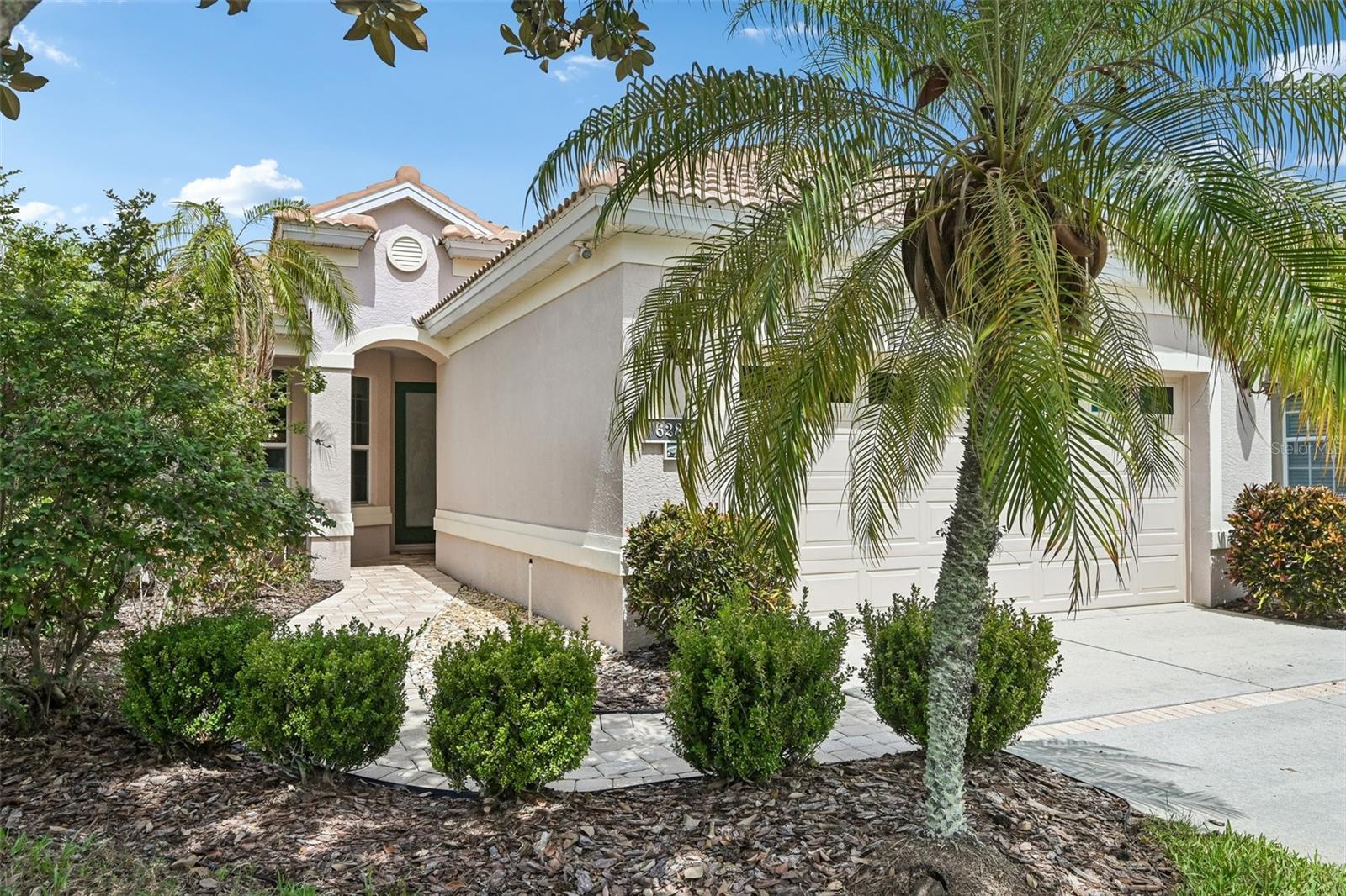**NEW TILE ROOF**(Installed July 2026)! Enjoy golf course views and sunsets overlooking the 3rd green of Tara Preserve Golf Club from this beautifully maintained and updated 3-bedroom, 2-bath pool home, where thoughtfully landscaped surroundings create a peaceful sense of privacy while showcasing the golf course views. The flexible split-bedroom floor plan includes a spacious den currently set up as a bedroom, offering versatility for guests, a home office, or hobby room.
A covered front porch leads into a light-filled home featuring vaulted ceilings, crown molding, custom built-in cabinetry, and an open living room highlighted by a lighted tray ceiling, creating a comfortable space for everyday living and entertaining.
The updated kitchen features cherry wood cabinetry, granite countertops, a travertine backsplash, stainless steel appliances, and a bright casual dining area. Neutral ceramic tile flows throughout the main living areas, while engineered hardwood floors add warmth to the bedrooms. Large sliding glass doors fill the living room with natural light while framing beautiful views of the covered lanai space, pool and golf course.
The private primary suite features a tray ceiling, overlooks the pool and golf course, and offers beautiful sunset views. Two large walk-in closets and a spacious en-suite bath with a soaking tub, separate shower, and private water closet complete the suite.
Recent improvements include a new tile roof installed in July 2026, new A/C (2023), exterior paint (2024), lanai cage rescreen (2024), updated designer lighting and ceiling fans throughout, and a NEMA 1450 outlet for EV charging.
Additional features include impact-resistant sliding glass doors, 125 mph-rated windows, a reinforced hurricane-rated garage door with full-width horizontal steel bracing, and the home is hardwired for a security system.
Enjoy maintenance-free living with low HOA and CDD fees, including lawn maintenance, Xfinity cable and high-speed internet, a heated community pool and spa, clubhouse with social activities, newly updated (2026) tennis and pickleball courts, a pay-as-you-go restaurant with no food minimum, and pay-as-you-play golf on Tara Preserve's renovated course featuring new greens (2026), no mandatory golf membership required. Sidewalks throughout the community and close proximity to the clubhouse and amenities add to the convenience of everyday living.
Located just minutes from Lakewood Ranch, University Town Center, I-75, downtown Sarasota, SRQ Airport, shopping, dining, Gulf Coast beaches, and Sarasota's cultural attractions, this home offers the perfect blend of updated comfort, maintenance-free living, and an exceptional location.