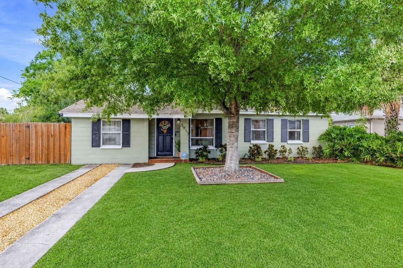 Virtually Staged. Tampa living awaits in this beautifully updated 3-bedroom, 2-bath home on an oversized, privacy-fenced lot with room to spare. Lovely landscaping and mature trees combine to create a warm welcome to the property. *Brand-new luxury vinyl flooring throughout (July 2026)* and fresh paint make this home move-in ready. The heart of the home is a spacious living/dining area flowing into a stunning kitchen with quartz countertops, newer cabinetry, stainless steel appliances including a new dishwasher, open shelving, a coffee bar, and a decorative stone backsplash - with direct backyard access. A split floor plan places the private primary suite at the end of the hall, featuring dual closets and a fully updated ensuite with hexagonal tile flooring, a large double vanity, and a custom glass-enclosed walk-in shower. Two generous secondary bedrooms sit near the second full bath with a shower/tub combo. Out back, the expansive privacy-fenced yard is built for living: a large patio deck, a fire pit for s'mores, and shade trees for a hammock. A double-wide gate allows boat or RV parking along the side yard, with plenty of room to make the space your own. Centrally located just minutes from the Selmon Expressway for quick access across the Tampa/St. Pete area, with major shopping nearby and the Marina District close by. Brand new refrigerator, washer, and dryer negotiable. Flood Zone X - no flood insurance required. 

(Some images are virtually staged with furniture and enhanced outdoor views to illustrate potential.)