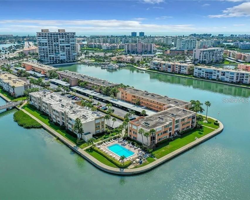 Beautiful Waterfront Lifestyle! This maintenance free condo sits directly in front of wide open waterfront! Gated community.
Featuring a new kitchen, new kitchen appliances, new bathroom, new high impact window, new high impact sliding glass doors, New Ac, New hot water heater. 
Spectacular water views! Remodeled and move-in-ready! The rooms are spacious and bright! The windows are tilt-in for easy cleaning. Assigned covered parking in front of the condo. This bright and cheerful condo is only steps away from the pool. Amazing sunsets and water view from the spacious living room and bedroom. Nice large kitchen window! Bay Island is a sought after gated 55+ community offering incredible recreational facilities, a social director - full calendar of social activities, library, banquet rooms, billiard, card rooms, tennis, fitness centers, pools and so much more! The condo fee covers water, sewer, trash, cable, internet, 24-hour gated security, building insurance. It's nice that St. Pete Beach is less than one mile away, and under 25 miles from Tampa International Airport. Unbeatable value! Turnkey-Move-In ready! Within minutes to restaurants, shopping, beaches, festivities and so much more!