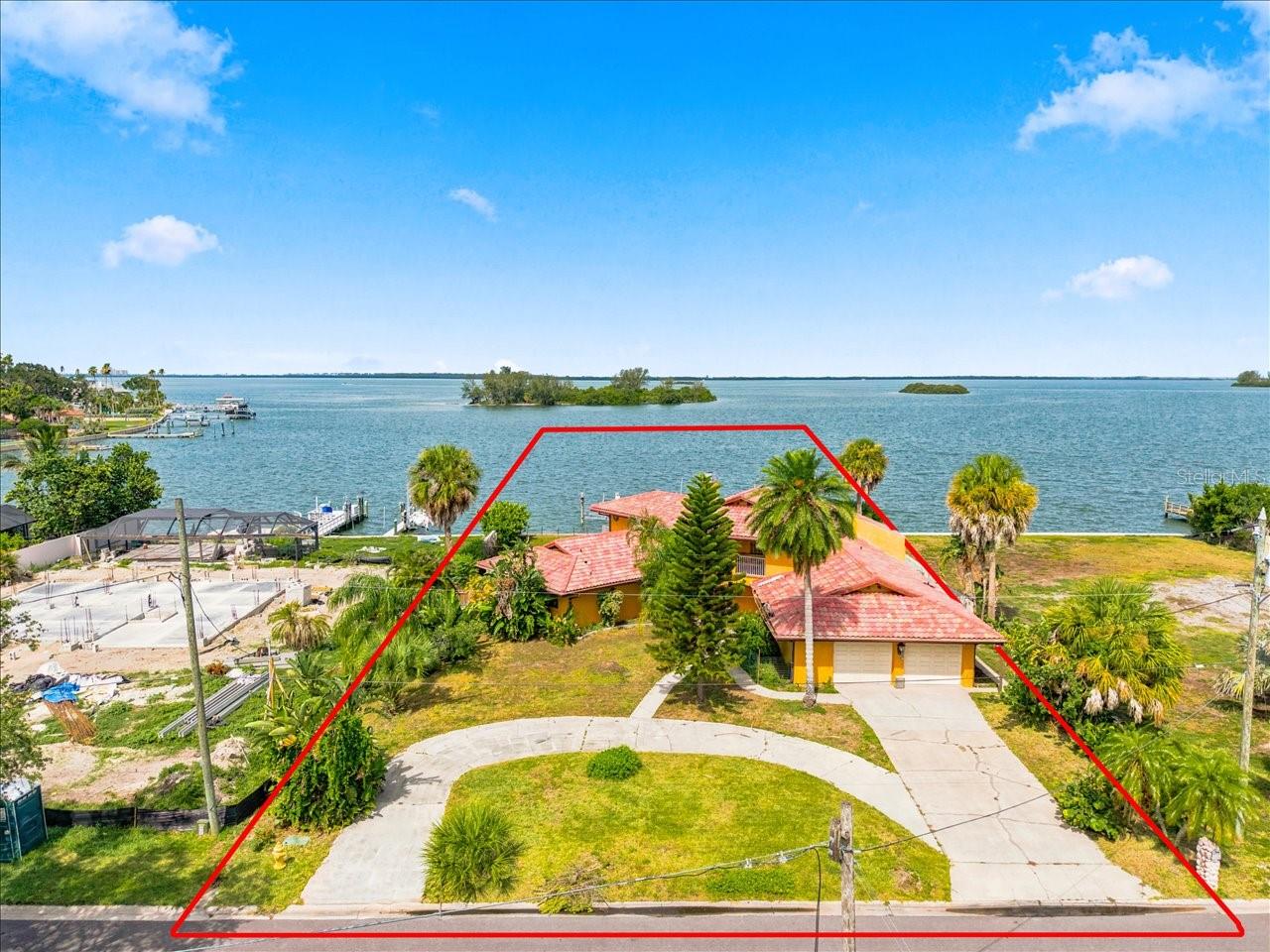 A rare opportunity has arrived to own an oversized premier waterfront homesite in Dunedin. This prime 100-foot lot offers sweeping panoramic views of St. Joseph Sound, Caladesi Island, Honeymoon Island, the Intracoastal Waterway, and Hurricane Pass to the Gulf. With exceptional frontage, breathtaking scenery, and a sought-after coastal setting, this property presents an ideal canvas for building the
dream waterfront residence you have envisioned.  Located in the iconic town of Dunedin, the homesite combines tranquil waterfront living with outstanding convenience. Enjoy being just two blocks from the Pinellas Trail, then take your golf cart to vibrant Downtown Dunedin for exceptional dining, craft cocktails, boutique shopping, and lively festivals. From your own property, take in stunning sunsets, abundant seabirds, and marine life, or launch into the coastal lifestyle with easy boating and kayaking access to Caladesi and Honeymoon Islands,
known for their miles of pristine white sandy beaches. Homesites of this size and setting are rarely available in Dunedin. Whether you
envision a custom coastal retreat, a private waterfront sanctuary, or a new construction residence designed around the views, this property offers a remarkable opportunity in a community celebrated for its history, warmth, and seaside charm.  Please note: The existing home was impacted by Hurricane Helene and the property is being offered for land value only. For buyers interested in a storm-damaged rehabilitation project, there may be a limited window to purchase the property with the existing concrete block home and pool still in place. If this possibility is of interest, act quickly, as demolition plans are already in motion and the seller intends to have the home and pool removed.
