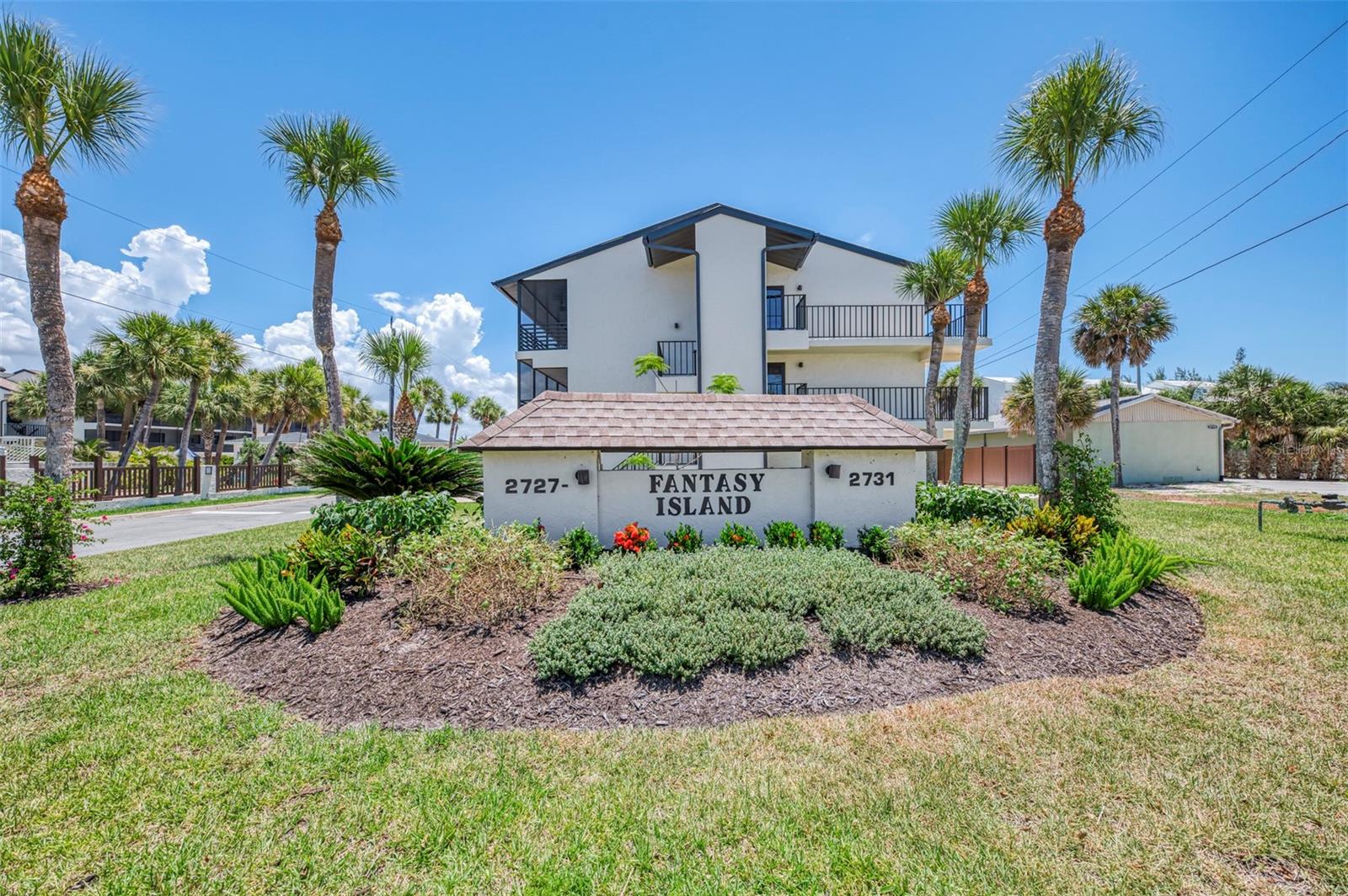 Priced to Sell! Location Location Location! Indulge in the ultimate coastal lifestyle from this beautifully updated, turnkey-furnished condominium at Fantasy Island on Manasota Key, offering stunning views of both Lemon Bay and the Gulf of Mexico. This spacious second-floor residence features an open split-bedroom floor plan designed for comfortable living and effortless entertaining. The updated kitchen showcases quartz countertops, stainless steel appliances, abundant cabinetry, a center island, and tile flooring throughout the main living areas. Impact-rated sliding glass doors fill the home with natural light while providing peace of mind and energy efficiency.  Both bedroom suites feature private sliding glass doors leading to their own balconies, creating the perfect retreat to enjoy the coastal breeze. The main living area opens to a private balcony with breathtaking bay and gulf views—an ideal setting for morning coffee, evening cocktails, and spectacular sunsets.  A standout feature of this property is the oversized tandem two-car garage, offering exceptional storage space for vehicles, a golf cart, kayaks, jet skis, bicycles, beach gear, and more. Additional parking is also available.  Residents enjoy deeded beach access just steps away, allowing easy access to the pristine sandy shores of Manasota Key. The community pool is currently undergoing renovation and is expected to be completed within the next few weeks. Ideally located near beautiful beaches, waterfront restaurants, live entertainment, shopping, and grocery stores, this exceptional property offers the very best of Florida coastal living. Opportunities like this on Manasota Key are rare - schedule a showing Today!