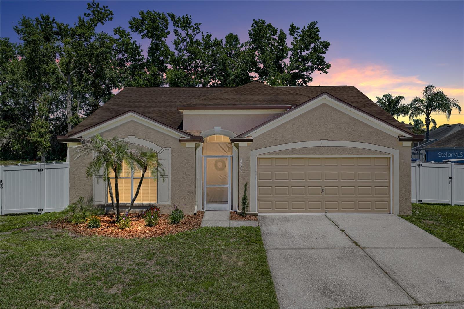 LOW LOW HOA only $350 a year & **NO CDD $0** Immaculate & Beautifully REMODELED ONE STORY 3 Bedroom w/2 Spacious Baths & Oversized 2 Car Garage home w/Soaring Ceilings & MASSIVE 27X10 COVERED SCREENED LANAI/FLORIDA ROOM & ADDITIONAL 27X10 SCREENED BIRDCAGE PATIO **w/NEW SCREENING (2026)** on Private Fully Fenced Dbl Gate Large 1/4 of an Acre Lot!! LOCATED IN THE HIGHLY SOUGHT AFTER LUTZ LOCATION off Wesley Chapel Blvd!! **BRAND NEW WATER HEATER (2026)**, **BRAND NEW Interior PAINT & EXTERIOR PAINT (2026)**. **NEW A/C IN (2023)**, **ALL NEW A/C DUCTWORK IN (2024)** **REMOVED POPCORN CEILINGS & NEW KNOCKDOWN TEXTURE IN ENTIRE HOME IN (2025)**, **NEW VINYL FENCING (2025)**NEW WATER HEATER (2020)**, **NEW INTERIOR DOORS**, Fantastic Open Layout! **NO CARPETING ANYWHERE!** LUXURY VINYL FLOORING & TILE THROUGH ENTIRE HOME.  **Large UPDATED KITCHEN w/Loads of Solid Wood Cabinets, QUARTZ COUNTERTOPS, Modern Single bowl UNDER MOUNT SINK, PULL DOWN SPAYER FAUCET, NEW PENDANT, LIGHTING, NEW CUSTOM TILE BACKSPLASH, NEW HARDWARE, Beautiful Eat in Area, Modern Flat Counter Height Seating, STAINLESS STEEL APPLIANCES & Spacious Pantry.** Open to Wonderful Great Room! Vaulted Ceilings in Kitchen, Dining Room, Family Room & Primary Suite make an amazing "Heart of the Home" This truly is a wonderful entertaining space & offers lots of room to spread out. **NEW Zebra Silhouette Blinds (2025)**, **NEW Modern Light Fixtures Throughout (2024-2026)**, **NEW CEILING FANS in all Bedrooms and Family Room (2024)**. Primary Suite is a True Sanctuary w/loads of space Fantastic for a King Size Bedroom layout, Massive 9X5 Walk in Closet, Ensuite Bath **w/NEW Dual Sink Vanity, NEW HARDWARE, NEW FIXTURES, NEW MAKEUP VANITY LIGHT, EXQUISITELY REMODELED SHOWER w/RAIN & HAND SHOWER & UPGRADED HEAVY WEIGHT BARN DOOR GLASS ENCLOSURE**, Private Toilet Room & Large Linen Closet. Second Bath is EXCEPTIONALLY REDONE & REMODELED **w/NEW VANITY**, **NEW HARDWARE, NEW LIGHTING FIXTURE & NEW LIGHTED MAKEUP MIRROR**, TUB & SHOWER Beautifully Done w/UPGRADED TILE & SHOWER GLASS ENCLOSURE.**, **NEW HE WASHER & DRYER (2025).**  Located in the Highly Sought After Kings Landing Subdivision w/access to the Private Airport & Restaurant!! Nestled Right in between the Fantastic Lutz/Wesley Chapel Area w/Well OVER 100 UNPARALLELED DINING OPTIONS, Nightlife, Rooftop Bar & Lounges, FANTASTIC Shopping, Costco, Sam's, Entertainment & Top Medical Facilities. Convenient to I 75, SR56 & SR 54. Enjoy the Shoppes at Wiregrass, The New Tampa Premium Outlets, The Grove at Wesley Chapel, Krate the super cool Venue offering dozens of Restaurants, Shopping & Entertainment w/LIVE CONCERTS & EVENTS like Watch Parties, Concerts, Dancing & More, Local FARMERS MARKETS, ANTIQUE CAR SHOWS & MORE! The Largest Ice Rink in the Southern US, Close to The First Outdoor Winter Snow Park Snow Cat Ridge w/Ice Skating, Tubing & Dining & Entertainment in the Igloo Village. Access to the best Healthcare NEW John's Hopkins Children's Hospital & Florida Medical Clinic Hospital Both Under Construction, Multiple New Advent Health Hospitals, New Bay Care Hospital, Moffitt Cancer Center, VA Hospital & USF Health. This home is in a prime location close in to Tampa and has amazing Easy Access to the interstates & all the shopping and restaurants without all the traffic! A quick trip to Busch Gardens. Great access to the Beaches & Downtown straight up either 56 or 54 only minutes to I-75 & 2-75. LOW HOA only $350 a year and NO CDD!!!