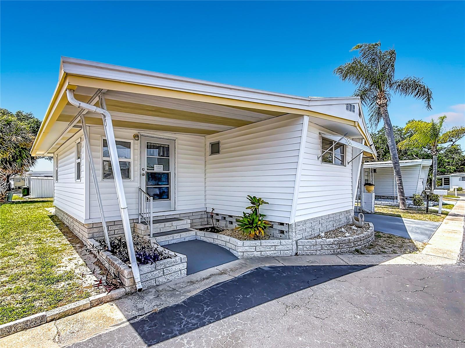 Winner of the “Best of Dunedin” Award for the Sixth Consecutive Year! Fractional Ownership. Live in Golden Acres – This fully furnished 2 bedroom, 1 1/2 bathroom home is move-in ready. NO storm damage or flooding from either hurricane. Non flood zone! The open layout flows seamlessly into bright living spaces, while a spacious carport accommodates two vehicles. Golden Acres is a highly desirable, resident-owned 55+ community spanning nearly 24 acres in the heart of Dunedin. Perfectly located off Main Street, less than a mile from Downtown Dunedin, and just minutes to the Gulf beaches, shopping, and dining. This award-winning community features a heated pool, shuffleboard courts, an active clubhouse with year-round activities, and beautifully maintained grounds. The cooperative ownership structure means each member owns an equal 1/224 share of the park. The purchase price includes the share ($23,800), and the low monthly fee of just $218 covers water, sewer, trash, lawn maintenance, and use of all amenities. All furnishings, washer/dryer are all included! Experience comfort, community, and coastal living at its finest in Golden Acres!