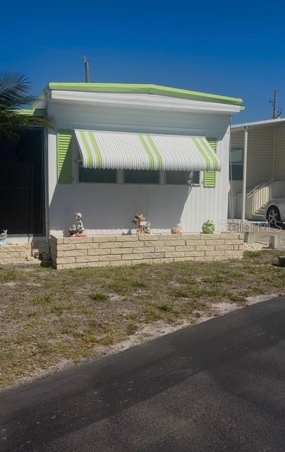 Charming and affordable 1-bedroom, 1-bath mobile home in desirable Osprey, FL! Situated on a spacious corner lot, this cozy residence offers great potential with a price that reflects the opportunity to update and make it your own. The open living room flows seamlessly into the kitchen, with space for a small dining table—perfect for casual living. The primary bedroom features a convenient built-in desk or makeup area, adding both function and charm. Durable metal siding and roofing provide peace of mind, while the extra-wide carport offers ample covered parking, complemented by additional public parking along the side lot. Enjoy Florida living outdoors with tropical palm trees welcoming you home, a large screened lanai for relaxing or entertaining, and a handy storage shed. Washer and dryer are included for added convenience. A great opportunity to own in a prime location with plenty of potential—don’t miss it! Located in the desirable Arbors community in Osprey, this home is part of an active, friendly neighborhood featuring a clubhouse, swimming pool, shuffleboard courts, outdoor fitness area and a full calendar of social activities. Ideally situated between Sarasota and Venice, you’ll have easy access to boutique stye shopping, multiple dining options, theaters, performing arts venues, and stunning Gulf beaches. Everything you love about the Florida lifestyle just minutes away. This is relaxed, low-maintenance living in a welcoming community.