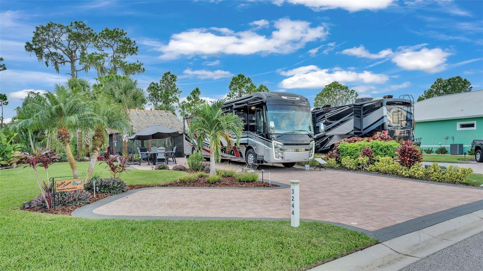 Beautiful lake view lot includes: Expanded lot with extra pavers, mature landscaping, a gorgeous water feature, custom outdoor landscape
lighting, 12’ x 20’ tiki hut screened in, lighting, several electrical outlets (cable ready), and a lifetime outdoor kitchen with bar seating by
Dreamscapes. This property wont last long! Bay Lake Motorcoach Resort is a Class A motorcoach resort offering incredible amenities. Owners
and visitors can fill their days with activities and club outings or simply relax and enjoy the resort. Whether in search of community, travel,
relaxation or recreation, Bay Lake is your home base for the Florida Lifestyle.