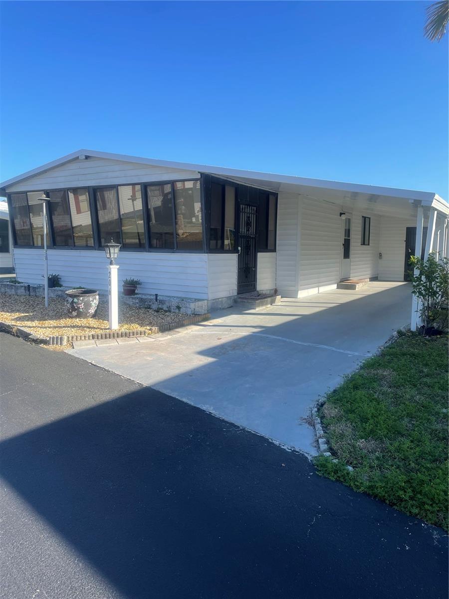 JUST REDUCED!! With OWNER FINANCING you can live the dream of owning beachside in this two bedroom, two bath home with a bonus Florida room. It is light and bright in the open Great Room, Dining Room and Kitchen area that is awesome for entertaining. There is tile throughout for easy beach living! Surfside Estates is a resident owned co-op community, located along the Intracoastal Waterway, just across the street from the beach and where you own your lot-share and never pay rent. The community has a low maintenance fee of $220 each month that includes cable TV, high-speed internet, lawn service, heated saltwater pool, two fishing piers and clubhouse. The clubhouse has a kitchen, pool tables, 86-inch TV, library, fitness center and shuffleboard. Along the Intracoastal, you will find a screened gazebo, fire pit, barbecue, benches, horseshoe pits, the two partially covered fishing piers, kayak racks and launch. With an active Social Club, you can choose from yoga, pool aerobics, an ice cream social, Movies in the Clubhouse, Bingo, pool teams, card tournaments, karaoke, dances, community breakfasts, potluck dinners, and so much more! Or take a walk, ride your bicycle, drive your golf cart, or motor to the Intercoastal Waterway and the beach. Either way, there seems to be something for everyone. This home is priced to sale and with OWNER FINANCING is not to be missed. CONTACT THE REALTOR FOR MORE INFORMATION!