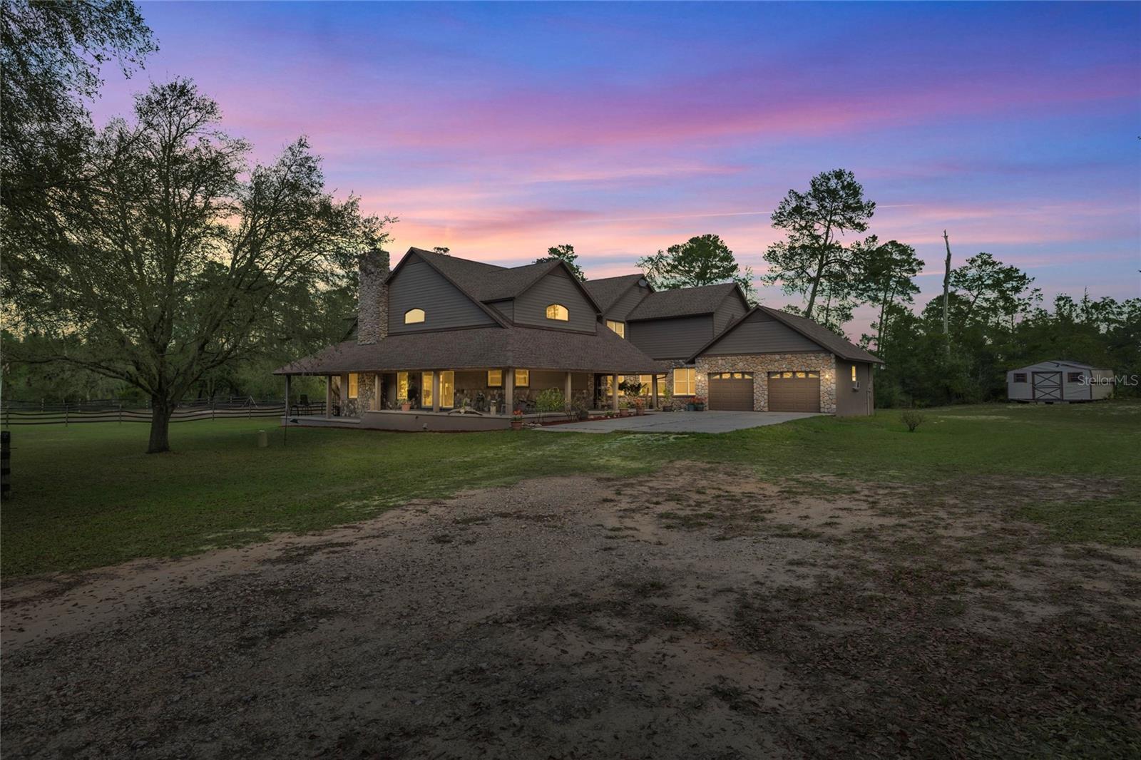 If you’ve been looking for a place where you and your horses can truly spread out—without being miles away from the action—this is the one. This 10-acre estate is tucked away at the end of a long, private drive, offering total peace and quiet just minutes from the World Equestrian Center (WEC).
The property is fully fenced and ready for your horses or whatever agricultural projects you have in mind. There is a solid barn on-site to get you started, and with 10 acres of land, you have plenty of room to add an arena or extra paddocks exactly how you want them. After a day at the showgrounds or out on the local trails, there’s nothing better than heading back to your own private retreat.
Inside, the home is spacious and relaxed with 3,910 square feet of living space. The open layout feels huge, especially with the floor-to-ceiling stone fireplace that really makes the living room feel like home. With 4 bedrooms, 2.5 bathrooms, a private executive office, and a big media/game room, there’s a spot for everyone. Plus, the oversized laundry room and walk-in pantry are absolute game-changers for keeping a busy farm life organized.
You can move right in and start enjoying the farm because the "big ticket" items are already taken care of. The roof, HVAC systems, and water heater were all replaced in 2021, so you can spend your time with your horses instead of worrying about maintenance.
The wraparound porch is the best seat in the house—perfect for hanging out with friends or just keeping an eye on the horses in the back pasture. Even though you’ll feel miles away from everyone, you’re still close to local shops and the incredible boating and fishing of the Nature Coast.
This is a rare chance to snag a high-end property in a prime Ocala-area location. Come see the potential for yourself!