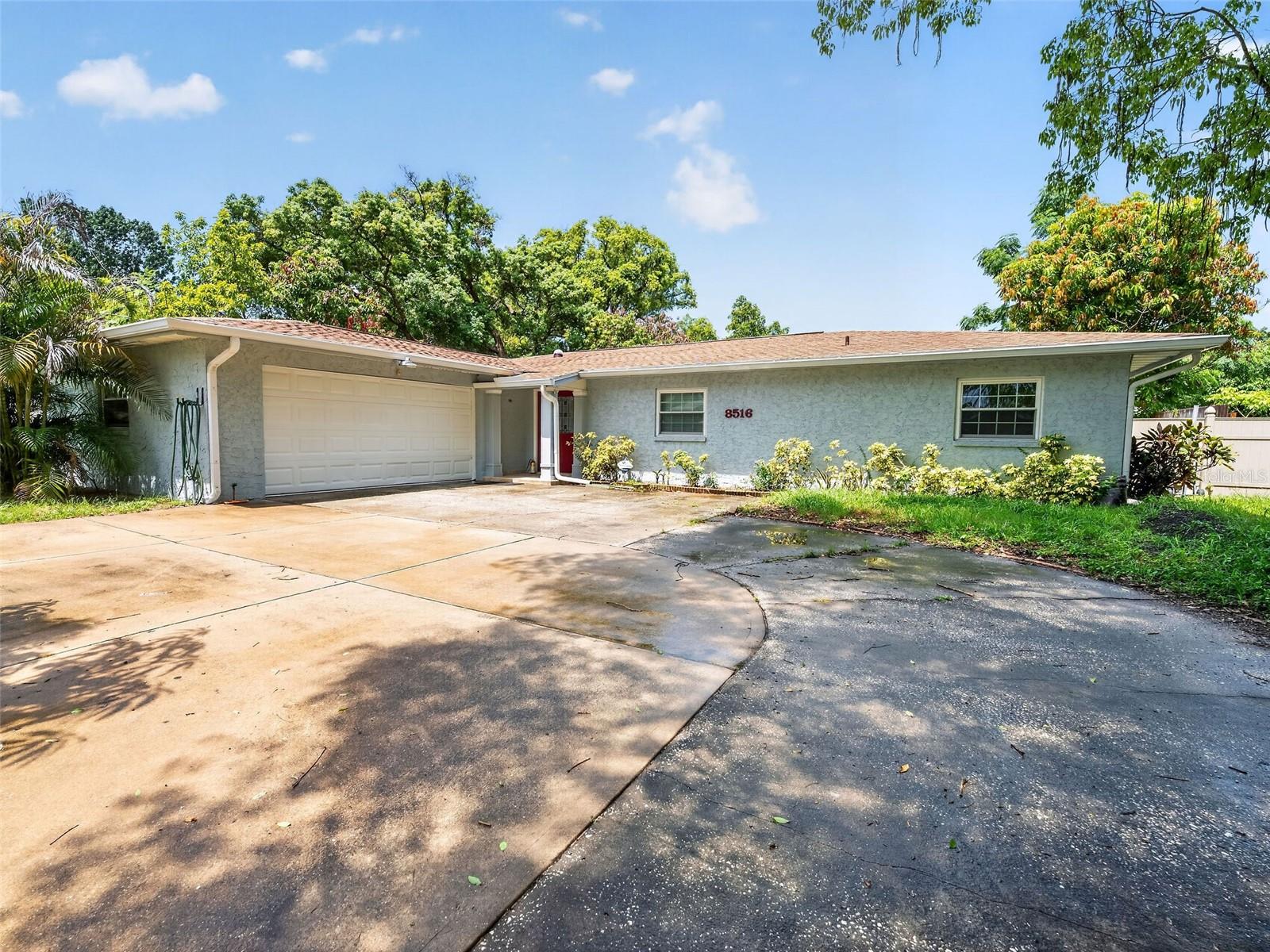 Welcome Home! Wake up every morning to beautiful eastern sunrises from this meticulously maintained residence, proudly positioned on an east-facing homesite in one of Tampa's most desirable and centrally located areas. This spacious home offers over 2,400 square feet of comfortable living space, where years of family gatherings, holiday celebrations, and unforgettable memories were created. Now it's ready for its next chapter. Featuring 3 generously sized bedrooms, 2 full bathrooms, and multiple expansive living and gathering areas, this home provides the perfect balance of comfort, functionality, and warmth. The oversized primary suite includes a luxurious en-suite bathroom highlighted by an exceptionally large walk-in shower, a beautiful, oversized window that fills the space with abundant natural light, and a relaxing atmosphere. The heart of the home is its elegant kitchen, beautifully designed with custom-style cabinetry, gorgeous granite countertops, and a convenient center island that creates the perfect space for cooking, entertaining, and everyday living. Multiple skylights—including a large skylight in the kitchen—fill the home with natural sunlight, creating a bright, inviting ambiance throughout. The enclosed, air-conditioned Florida/Game Room, surrounded by large windows, offers an incredible flex space ideal for entertaining guests, hosting family gatherings, a media room, home office, fitness room, or simply relaxing while enjoying peaceful backyard views. This home has been lovingly cared for and includes numerous valuable updates, including New architectural shingle roof (approximately one year old), hurricane-impact windows throughout, new gutters surrounding the entire home, updated electrical panel and wiring and HVAC system, spacious two-car garage with its own dedicated air-conditioning unit, front-facing window, and side exterior access door,well-maintained septic system and drain field with consistent maintenance since installation. Step outside to discover a beautifully landscaped backyard featuring mature orange trees, flowering plants, and meticulously maintained greenery, creating a peaceful outdoor retreat perfect for relaxing or entertaining. Location is everything—and this home truly delivers. Ideally situated in the heart of Tampa, between Busch Boulevard and Waters Avenue, with immediate access to North Armenia Avenue, Dale Mabry Highway, I-275, and the Veterans Expressway. Enjoy the convenience of being just minutes from Tampa International Airport, Downtown Tampa, Raymond James Stadium, International Plaza, Midtown Tampa, Tampa Premium Outlets, hospitals, restaurants, shopping, entertainment, and the world-famous Busch Gardens Tampa Bay. Located within the highly sought-after 33614 ZIP code, one of Tampa's most convenient and rapidly growing areas, this home combines space, quality, updates, and an unbeatable central location. Move-in ready and meticulously maintained, this exceptional property offers comfort, character, and endless possibilities. Schedule your private showing today and experience everything this beautiful home.