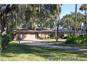 Own a piece of New Smyrna history! This beautifully treed property overlooks the backwaters of the Intracoastal from a high knoll. Original Florida 1950Âs architecture with one owner! Solid home with parquet flooring in living & dining rooms & 2 of the bdrms. Terrazzo in spacious family room. Den with wood paneling & built-in bookshelves. Retro baths. Lots of closets. Huge covered screened porch is accessed from many of the rooms that overlook the Âpark likeÂ waterfront setting. Old boat house structure in need of renovation. New roof December 2012. Separate storage workshop building. Plenty of room to build garage. Sold Âas isÂ, inspections welcomed. Please note: Lot dimensions & acreage calculations are estimated only & will need to be verified by survey. Buyer to pay title insurance. ;Water: City