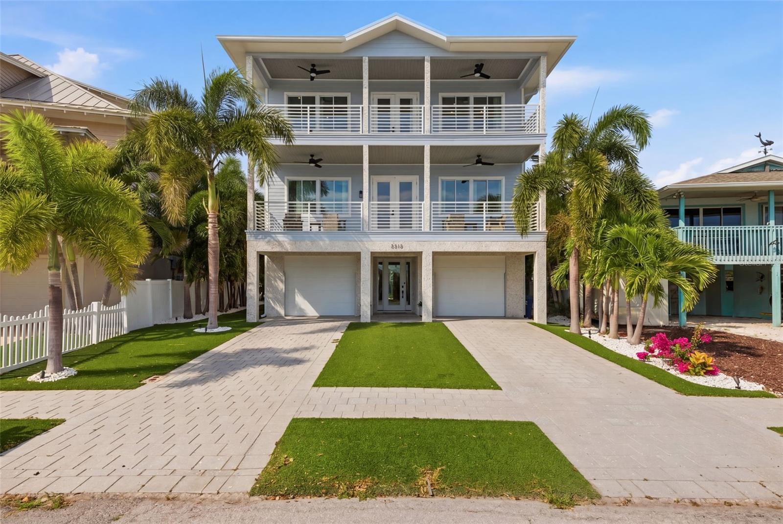 Experience elevated coastal living in this stunning 3-story beach home located in one of Tampa Bay’s most sought-after waterfront communities of Pass a grille. This beach home is located near the iconic Don Cesar and seconds to the beautiful Gulf. This beautifully designed residence features 4 spacious bedrooms, 4 full bathrooms, and 1 half bath, offering the perfect blend of luxury, comfort, and functionality. Boasting a 3-car garage, this exceptional home is ideal for both full-time living and vacation-style entertaining. The open-concept floor plan is filled with natural light, showcasing expansive living spaces, designer finishes, and multiple levels of refined indoor-outdoor living. The home features an elevator to access all three floors and front and back porch patios to watch sunsets. Step outside to your private tropical oasis featuring a saltwater pool and spa, outdoor porch, turf and lush landscaping with a personal putting green, perfect for relaxing after a day at the beach or entertaining guests year-round. Complete with durable Pompeii Quartz and Thermador Appliances. The primary suite resides on the 3rd level covering the entire front of the home, capturing the gulf/water views. 4 spacious covered balconies ensure comfortable indoor/outdoor living. CaliBamboo Engineered hardwood floors throughout home, that have a limestone composite foundation, giving them more of a water/scratch resistance, so you can enjoy the fun beach living with low maintenance floors. The elevator to all 3 levels is centered in a wrap around “Stair Tower”. Laundry/pantry rooms are on both the 2nd and 3rd levels. Every ensuite bedroom has it’s own bathroom, walk-in closet with custom shelving, and balcony access. Quick access to I-275 that will take you to Downtown St Pete in less than 10 minutes or Tampa International Airport in 30 minutes.This home also features a 16,000 lb boat lift and private boat dock. Enjoy the ultimate Florida lifestyle with generous outdoor space, elevated balconies, and close proximity to the Gulf beaches, dining, and shopping. Whether you’re seeking a luxury primary residence or an incredible coastal retreat, this one-of-a-kind property delivers sophistication, space, and resort-style amenities in an unbeatable location.