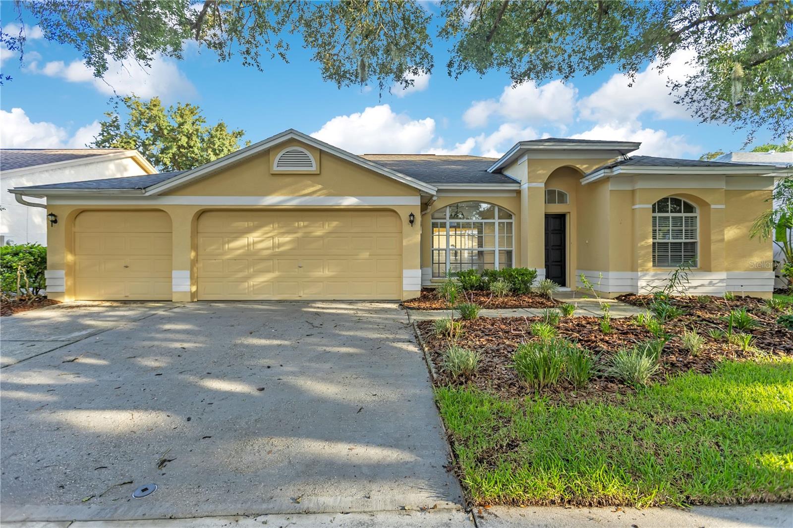 VR tour available! NEW exterior paint coming soon! Up to $22,095 in seller credits toward closing costs, prepaids, or an interest rate buydown. Welcome to this move-in ready 4-bedroom, 3-bath pool home offering 2,179 square feet of living space, a desirable single-story layout, and a 3-car garage in the guard-gated community of Hunters Green. Recent updates include a new roof (2025), new HVAC (2026), water heater (2023), fresh interior paint, and new luxury vinyl plank flooring. Inside, you'll find vaulted ceilings, formal living and dining areas with a wood-burning fireplace, and a spacious kitchen featuring granite countertops, a breakfast bar, and a pantry. The primary suite includes a walk-in closet and an updated en suite bathroom with a new dual-sink granite vanity, a garden tub, and a separate shower. Enjoy Florida living year-round from the screened pool overlooking the fenced backyard. Hunters Green offers parks, playgrounds, tennis and basketball courts, sports fields, scenic lakes, walking and biking trails, and optional membership to the Hunters Green Country Club with its 18-hole championship golf course. Conveniently located near I-75, I-275, USF, top hospitals, shopping, dining, and Downtown Tampa.