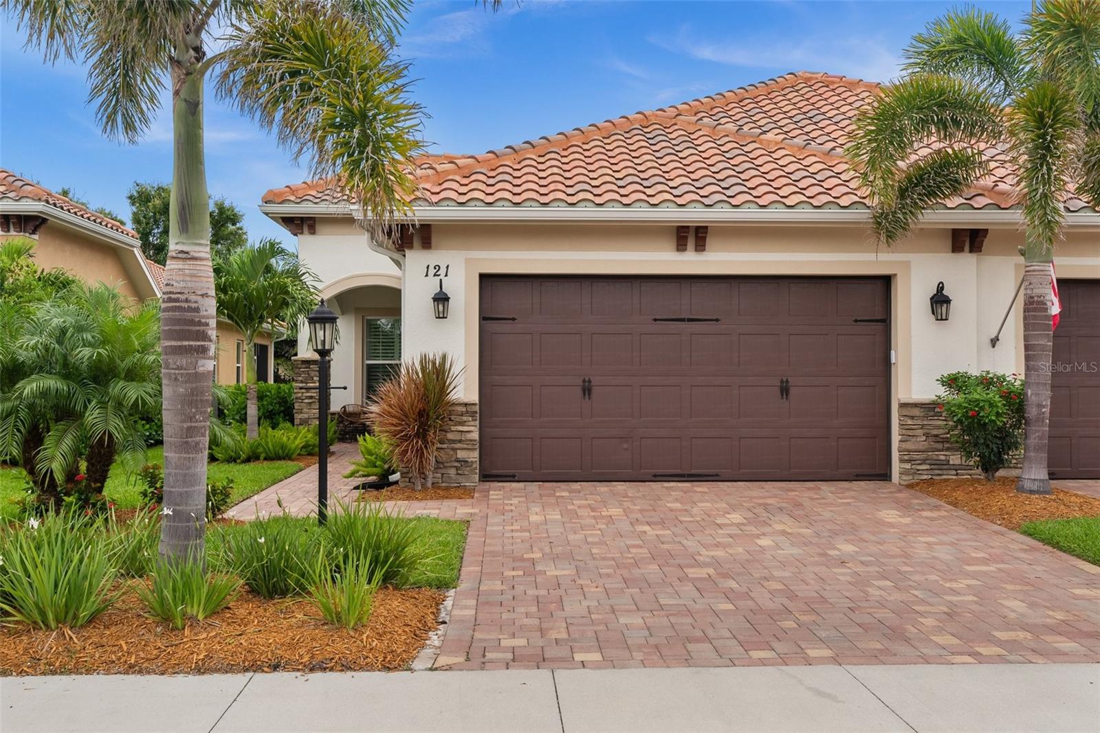Welcome to your dream villa in the desirable Cassata Place community—just 3 miles from charming Downtown Venice and the beautiful shores of Venice Beach! This 4-years-new home offers modern comfort, quality construction and elegant design. Featuring full impact doors and windows, a tile roof and gutters, it’s built with durability and peace of mind in mind. The open floor plan flows effortlessly from room to room, with sliding doors leading out to a covered and screened lanai—perfect for relaxing or entertaining. The spacious kitchen includes a pantry and features stainless steel appliances, stone countertops and white cabinets. The primary suite features two walk-in closets and a private bath retreat. A bonus room provides the flexibility for a home office, den or hobby space. Additional highlights include a laundry room with closet space, ceiling fans in all bedrooms and the living room and plantation shutters. Finally, the 2-car garage features epoxy flooring as well as a utility sink and the driveway is complete with pavers. Cassata Place residents enjoy access to a heated community pool that’s 5 feet deep—ideal for a refreshing dip year-round. Don’t miss this opportunity to live just minutes from world-class beaches, shopping, dining and everything Venice has to offer!