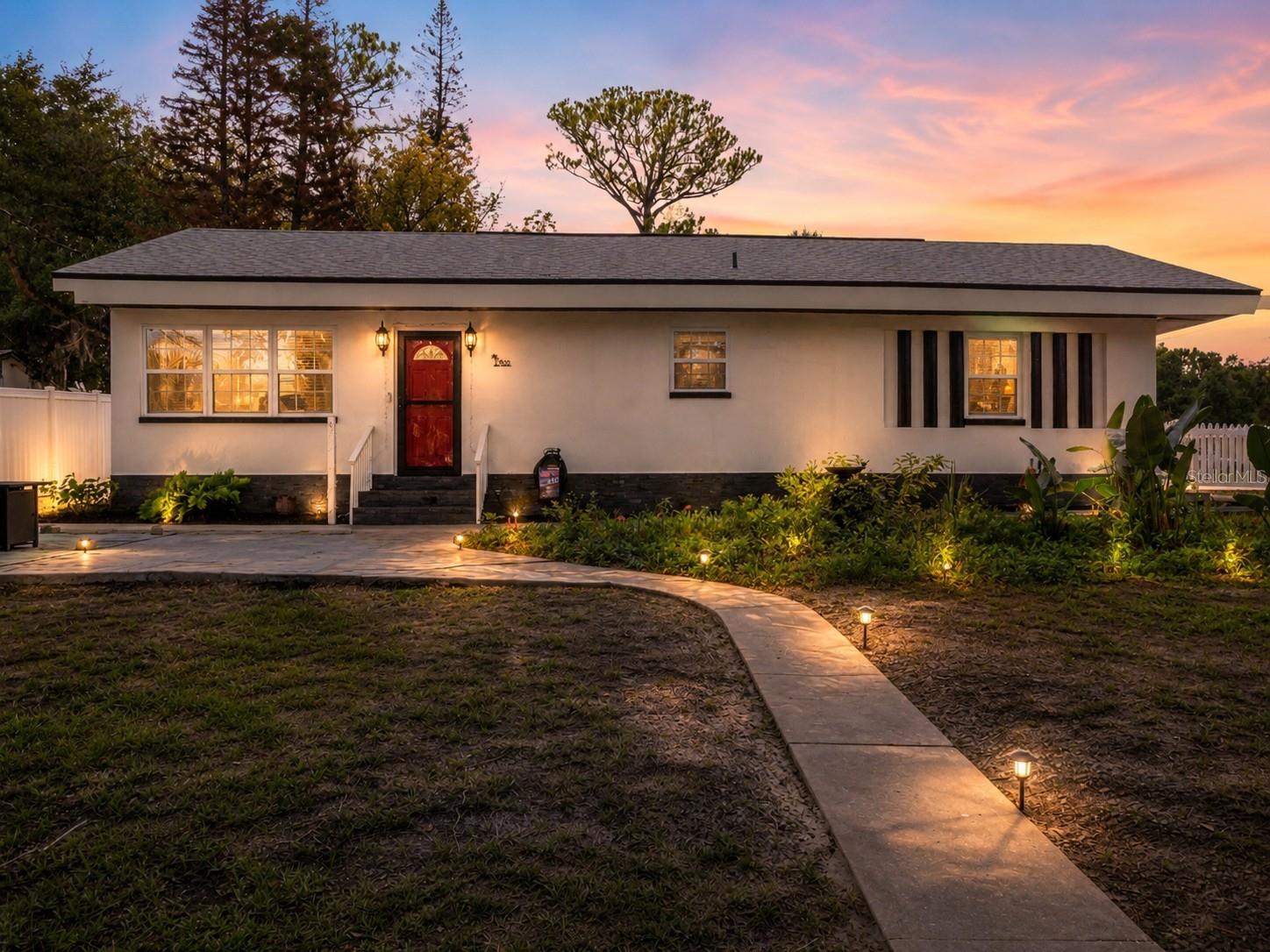 ROOF 2023 - WINDOWS 2023 - AC 2023 - FULL HOME REMODEL IN 2023!!

Completely renovated from top to bottom in 2023, this move-in-ready Ormond Beach home offers the perfect combination of modern updates, an ideal location, and coastal living. Situated less than one mile from charming Historic Downtown Ormond Beach and only five minutes from the beach, you'll enjoy easy access to local restaurants, boutique shopping, parks, entertainment, and Florida's beautiful coastline.

This beautifully updated home features 3 bedrooms, 3 full bathrooms, and 1,056 square feet of thoughtfully designed living space. Nearly every major component has been replaced, including a new roof, new air conditioning system, new windows, tankless water heater, updated electrical and plumbing fixtures, stylish new bathrooms, flooring, and a stunning new kitchen—allowing you to move in with complete peace of mind.

The heart of the home is the beautifully designed kitchen, showcasing soft close white shaker cabinets with pull out drawers, quartz countertops, stainless steel appliances, and a large center island with seating for barstools, making it the perfect place to gather with family and friends. The kitchen flows seamlessly into the living room, creating an open and inviting space for everyday living and entertaining.

The split-bedroom layout offers excellent privacy, with the primary suite tucked away from the two guest bedrooms. Wood-look tile flooring runs throughout the main living areas, while the bedrooms feature attractive laminate flooring for added warmth and comfort.

Outside, the fully fenced backyard is enclosed by a charming white vinyl picket fence, providing a private space for pets, play, or relaxing outdoors. The one-car garage features beautifuly finished floors, a washer and dryer that convey with the home, and a peaked roof offering valuable additional storage space. An attached carport and extra parking provide plenty of room for multiple vehicles, guests, or recreational equipment.

With every major update already completed and an unbeatable location just minutes from both Historic Downtown Ormond Beach and the beach, this home is the perfect opportunity for full-time residents, seasonal owners, or anyone looking to enjoy the best of Florida living.