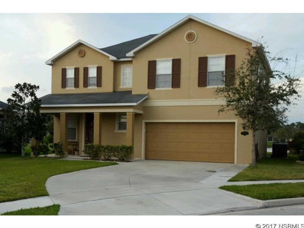PRICED TO SELL!! BEAUTIFUL LARGE LAKE FRONT HOME NESTLED ON QUIET CUL-DE-SAC IN ISLES OF SUGAR MILL WITH PRIVATE COMMUNITY POOL AND PARK. THE KIDS WILL LOVE THE OVER SIZED YARD AND YOU WILL LOVE THE EAT-IN KITCHEN WITH BREAKFAST BAR THAT OVERLOOKS A TRANQUIL LAKE SETTING. HUGE MASTER BEDROOM (27X14) AND ONE OF THE LARGEST WALK-IN CLOSETS WE HAVE EVER SEEN. THE KITCHEN IS A COOKS DREAM WITH LOTS OF STORAGE AND COUNTER SPACE WITH A HUGE WALK IN PANTRY/UTILITY ROOM. ENJOY THE LAKEFRONT OUTDOORS IN THE SCREENED PORCH AND FAMILY COOKOUTS ON THE ADJOINING PAVER PATIO. ONLY MINUTES TO BEACH, RIVER, SHOPPING, DINING, AND CLOSE ACCESS TO I95. THE HOME SHOWS LIKE NEW. DON'T MISS THIS FANTASTIC FAMILY HOME WITH A UNIQUE SETTING AND LOCATION. DON'T MISS THIS GREAT BUY! ;Water: City