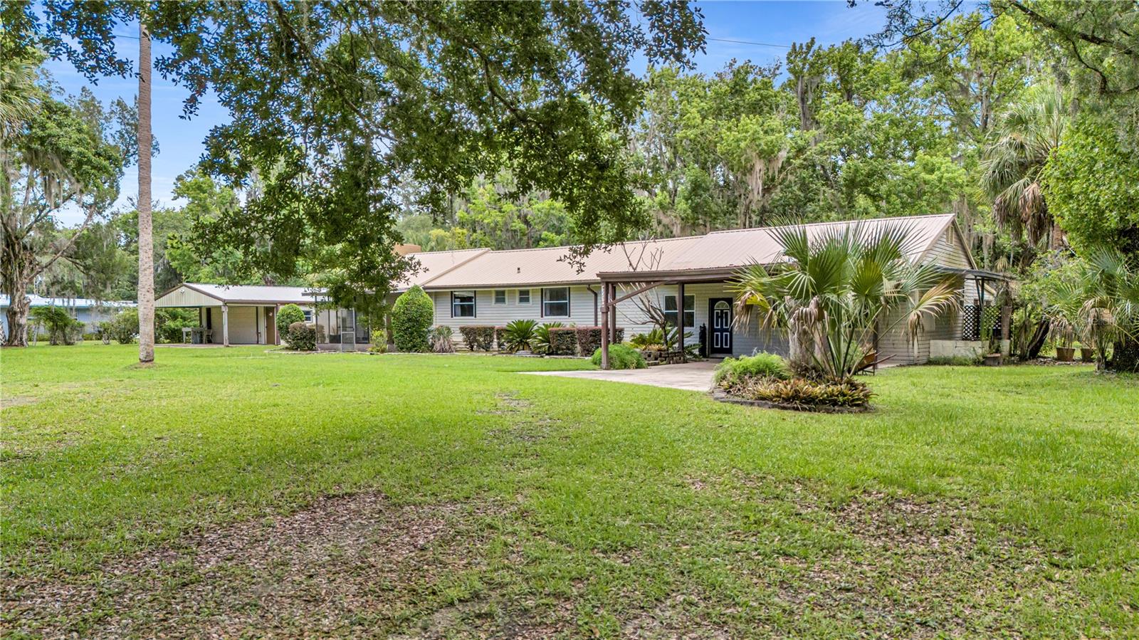 1+/- Acre Waterfron Retreat!! Stunning property with large Home, nice Garage, and Boathouse & Access to the St. Johns River!
Escape to peaceful country living in this  3-bedroom, 3.5-bath canal-front home offering approximately 2,340 square feet of living space on nearly 1 acre of land. Whether you're searching for a full-time residence, weekend getaway, or vacation retreat, this property delivers the perfect blend of comfort, privacy, and outdoor adventure.
Designed with both entertaining and everyday living in mind, the home features a spacious open floor plan with a desirable split-bedroom layout. The impressive great room showcases stunning canal views and provides the ideal gathering space for family and friends. Cathedral ceilings enhance the home's spacious feel, while solid wood cabinetry adds warmth and timeless character throughout.
Enjoy Florida's natural beauty from either of the two screened porches, where you can relax and take in the tranquil surroundings. Outside, mature landscaping and majestic oak trees create a picturesque setting filled with wildlife, including sandhill cranes, wild turkeys, and deer.
Boating enthusiasts will appreciate the two-bay boathouse with electric, water, and boat lifts, providing easy access to the canal and the scenic St. Johns River. A generous 24' x 22' garage offers plenty of room for vehicles, tools, and recreational equipment.
Located just steps from the world-famous Ocala National Forest, this property is a dream for nature lovers, anglers, boaters, and outdoor enthusiasts seeking privacy and serenity without sacrificing convenience.