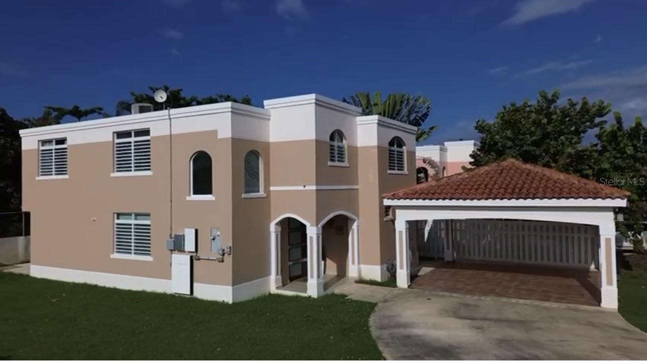 BACK TO THE MARKET> If you missed it the first time around, here is your opportunity to visit this wonderful home. We present this elegant two-level residence, located in the exclusive gated community of Grand Palm 2, in the picturesque town of Vega Alta. This property combines spaciousness, privacy and a well resourced location, ideal for those seeking quality of life and comfort.

Key features of the property:
Two levels of construction.
Four (4) spacious bedrooms, perfect for family comfort and three (3) full bathrooms.

This Open-Concept design invites you to enjoy its spacious Grand Room, ideal for family gatherings or social activities. Likewise, the kitchen, which includes a separate walk-in pantry, offers ample storage space and is just across from the family room so that you can chat while making meals. The Family room double doors, open up as they provide access to the outdoor patio/backyard green area. The convenience of a full bathroom on the first level of the home assures the second-floor privacy. This Layout allows for a flowing transition as you move throughout the different spaces, creating a sense of comfort & amplitude. As a corner 529.24 sq/meter lot with no neighbors on the left side nor back of the property line, it provides privacy and multiple possibilities for outdoor area enjoyment or future improvements.

Community amenities:
Swimming pool
Gym
Tennis court
Half basketball court
Controlled access with security

Prime location:
*Proximity to Cerro Gordo beach, one of the most popular coastal destinations in the area.
*GPS clocks it at 1.3 miles from the beach
*Neighboring town with Dorado and within proximity of the Expressway, facilitating access to San Juan and other nearby municipalities.
*Shopping centers, private schools, and recreational areas are also within proximity.
This residence represents an excellent opportunity for those who want to live in a safe environment within a small community and with ample space and access to comfortable recreational facilities.