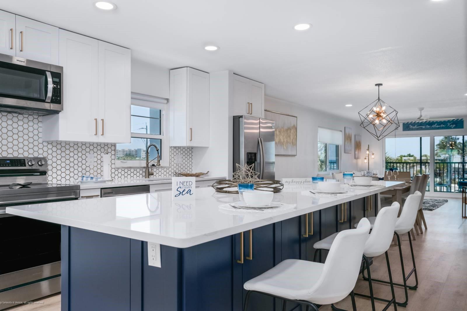 Your Florida beach escape awaits — and with a motivated seller, this is an opportunity you won't want to miss.... take a look at this condo that is steps away from the quartz crystal white powdery sands and warm Gulf waters of the award-winning Siesta Key Beach?  This wonderfully located turn-key, furnished end unit condo is oh so unique on the top floor with views of the beautiful white sandy beach and sparkling blue Gulf waters, a rare, remodeled find on the spectacular Gulf coasts of Florida! The rental income is excellent! This recently, completely remodeled from ceiling to floor, wall to wall, unit has 2 bedrooms, 2 bathrooms, hard flooring throughout, a sprawling island, quartz countertops, impact windows and sliders, AND has a spacious balcony, ready for you to relax and enjoy. This unit transfers with $50,000 in furnishings and furniture.  This is a perfect place for you to have your dream of a beach life come to reality, with the potential of using it to generate income with monthly rentals. This amazing mid-rise condominium community offers a heated community pool, outside grills, a clubroom with a kitchen, plenty of guest parking and a laundry room on each floor. Recent improvements include newer roofs 2020, a newer elevator 2019, re-plumbed stacks 2018, refreshed landscaping 2020, and new vinyl fencing 2021. The quarterly fee includes access to the heated community pool, basic cable, water/sewer, pest control, weekend on-site maintenance person, and community insurance. Enjoy convenient access to Siesta Key Beach and to Siesta Key Village shops and restaurants with the free trolley service that stops right in front of the Beach Way community, or, walk, orrrrr take a bike cruise to many nearby shops and restaurants… You are not only buying a beach property, you are buying a lifestyle in the beautiful Southwest Florida Sun. This unit can be your own sanctuary escape and your retirement investment... Come see, come sigh and make this Siesta Key lifestyle in the Sun your own.