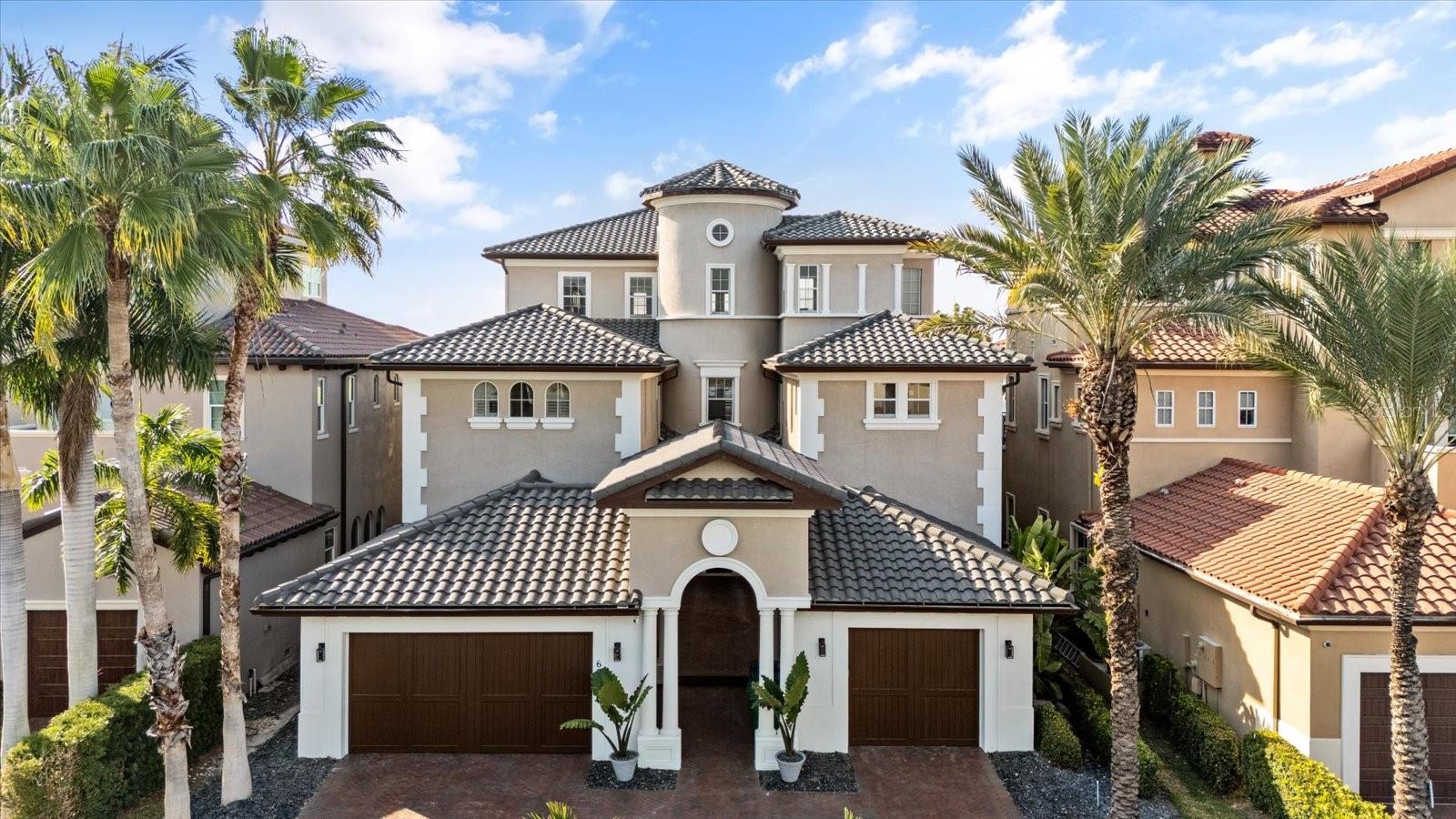 Located within the exclusive gated waterfront community of Westshore Yacht Club, this extraordinary residence presents a rare opportunity to own a home that has been extensively renovated with premium finishes and thoughtful upgrades throughout. Designed to feel both impressive and comfortable, the property offers a refined coastal lifestyle with exceptional attention to detail.

The interior showcases imported Italian tile throughout the main living areas, striking custom chandeliers spanning from the first through third floors, and elegant architectural elements that add depth and character. The chef’s kitchen is a true highlight, featuring custom cabinetry, restaurant grade Wolf appliances, and distinctive Labradorite and quartz countertops. A whole home water filtration system enhances everyday living.

Significant system improvements include lighting and pool automation, LED lighting throughout the interior and exterior, and multiple HVAC and water heater replacements providing efficient climate control across all levels of the home. In 2025, the residence was further elevated with a new roof, new flooring throughout, fully updated bathrooms with new tile, fixtures, toilets, and a steam room, along with new countertops and new or refinished cabinetry.

Outdoor living is anchored by a heated saltwater infinity pool surrounded by porcelain deck tile, fresh landscaping, and turf installation, creating a private and inviting space ideal for both entertaining and relaxing.

Residents of Westshore Yacht Club enjoy a premier waterfront lifestyle with access to marina amenities, a private clubhouse, dining, fitness facilities, resort style pools, and 24 hour gated security, all conveniently located near downtown Tampa, Tampa International Airport, and the Westshore Marina District.

This home offers a truly move in ready opportunity in one of South Tampa’s most sought after waterfront communities.
