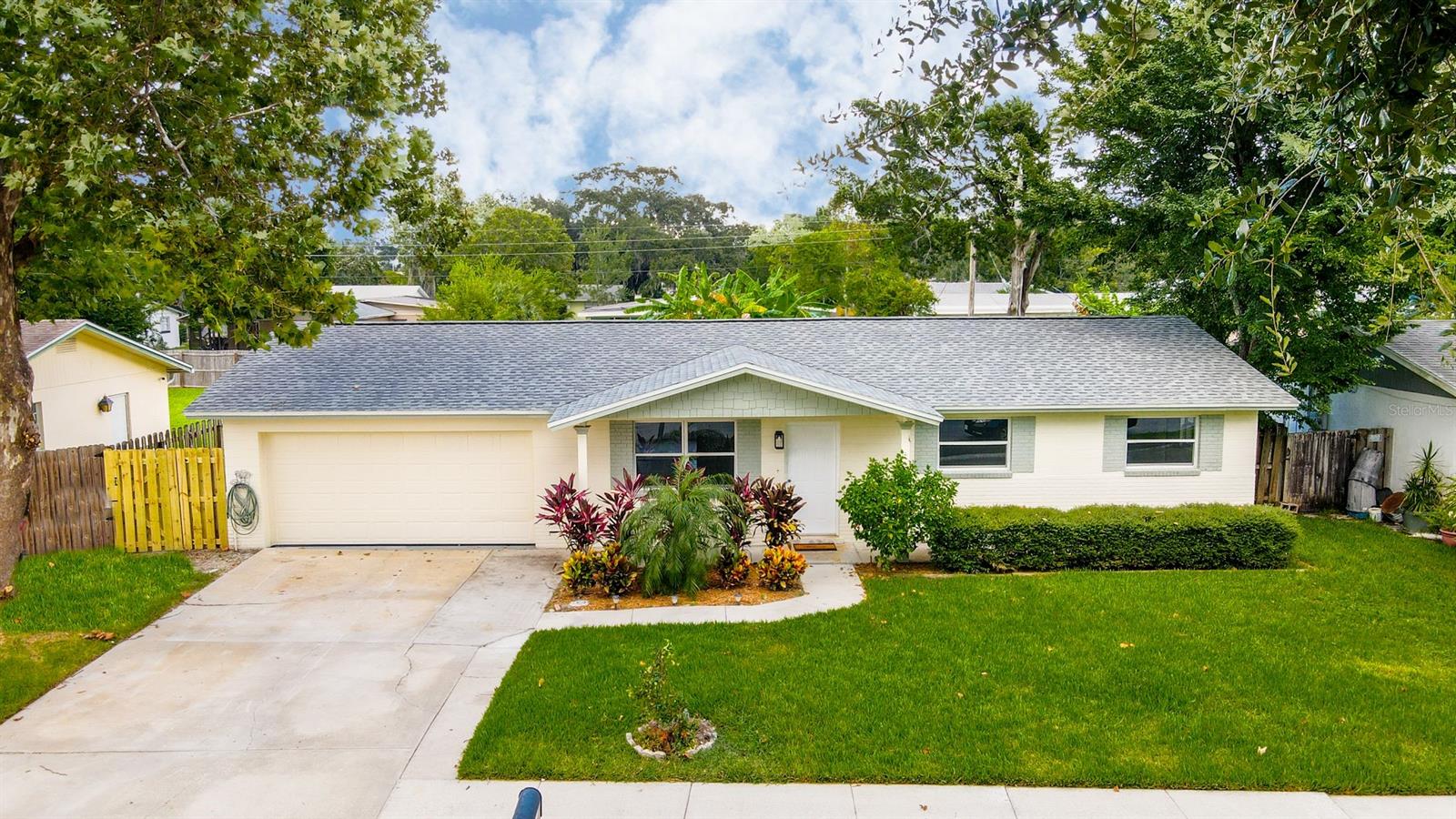 This move-in ready, 4 bedroom, 2 bath home with a 2 car garage and fully fenced yard in South Daytona has been renovated from top to bottom!  Upgrades and updates (completed in 2020) include a new roof, electrical panel, exterior doors, exterior paint, interior paint, carpet, stainless appliances, granite kitchen countertops, hall bath vanity, medicine cabinet, and lights, all closet doors, complete owner's bath renovation, and many more!   The front living room leads to an L-shaped kitchen.  The kitchen opens to an oversized family room which has ample natural lighting and a new remote-controlled fan and light fixture.  The owner's suite features a beautiful completely remodeled bathroom, including a tiled shower, new vanity, and new flooring.  Don't miss this gem!  All room dimensions, square footage, and other information intended to be accurate, but not guaranteed.  Buyer to verify. ;Water: City