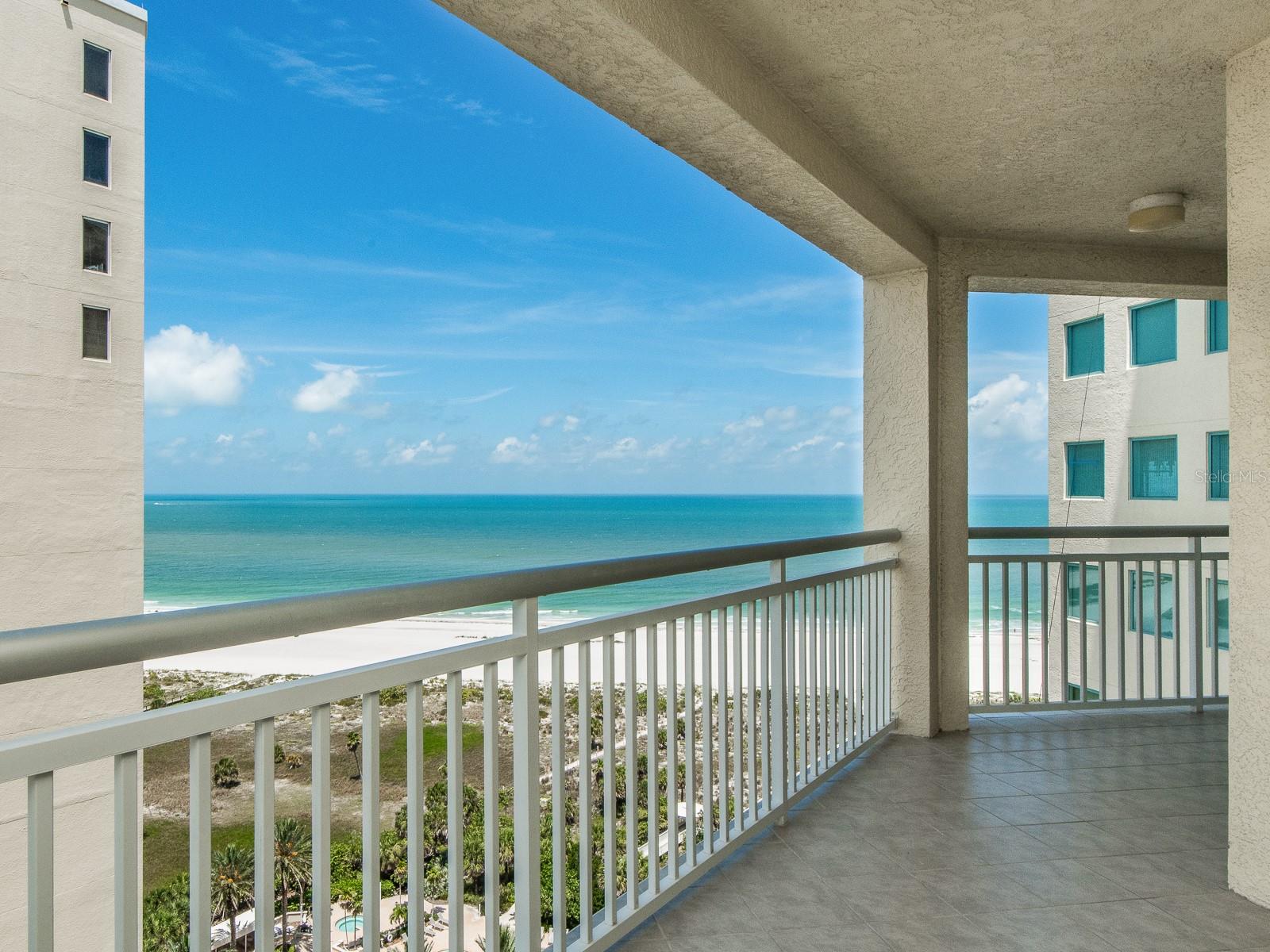 Experience this well-maintained residence featuring bright, open layout that seamlessly integrates indoor and outdoor living. The expansive main living area is bathed in natural light and flows effortlessly into the kitchen. Enjoy breathtaking gulf views the moment you enter this stunning property. This unit offers three bedrooms and two bathrooms, including a generous primary suite with a well-appointed bath and ample closet space. Additional bedrooms provide versatile options for guests, a home office, or family needs. Relax on the private southwest-facing balcony and enjoy the breezy charm of Florida living. Located in the sought-after community of The Grande on Sand Key, the property includes one underbuilding parking space with additional guest parking available. Residents have access to resort-style amenities, including two pools, an oversized hot tub, sauna, fitness center, clubhouse, and secure entry. This move-in-ready home combines style, comfort, and an exceptional location, ideal for full-time residence or a lock-and-leave coastal retreat. Schedule your private showing today.