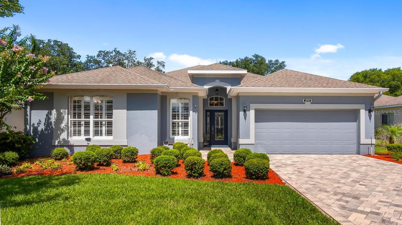 Ideally located in a popular guard gated 55+ community, with over 2000 sq ft. of contemporary style golf living on the 7th tee box looking down the fairway, sits 4010 Hammersmith a rare and beautiful St James.  The minute you pull up to the home you will be greeted with a paver drive and walkway. This home combines the finest finishes with multiple upgrades. This exquisite 3 Bedroom 2 Bath with a Florida Room can adapt to any lifestyle. With Luxury Vinyl and Porcelain Tile, and large windows, this home offers an open, airy floor plan with lots of natural light for your enjoyment and that is perfect for entertaining family and friends. As you walk through the leaded glass front door you will be greeted with a spacious great room and formal dining room graced with high ceilings and crown molding. This open, bright, and spacious great room, is combined with a Florida room with plantation shutters that overlooks the golf course.  As you move on the modernized updated spacious kitchen you will find an abundance of wood cabinets, quartz counter tops, and backsplash. The kitchen is also updated with slate stainless-steel appliances, refrigerator, dishwasher, & microwave.  Off of the Kitchen you will be pleased to see a large eat in area large enough for a hutch or a buffet for entertaining guests while enjoying the golf course views which is perfect for great conversations.  The den/office/study has a closet and can be used as a 3rd bedroom if needed.  The generously proportioned primary bedroom with soft lighting creates a soft ambiance and has views of the Golf Course. Escape to a relaxing retreat within the ensuite with his and her sinks, and separate tiled zero threshold walk-in shower.  The ensuite has an abundance of cabinet space in the bathroom. The spacious primary bedroom is graced with 2 large walk-in closets. The owner has gone to the expense of enlarging one of the walk-in closets. The spacious guest room is perfect for hosting family and friends.  The spacious 2nd Bath is strategically placed close to the 2nd bedroom for your guest convenience.   Escape to the beautiful screened lanai with Sun Setter motorized awning those relaxing quiet nights. This updated golf course home boasts 6 New Windows across the back.  AC 2017, Roof 2014, Hot Water Heater 2 or 3 years old, leaded glass front door, crown molding, paver driveway and walk way,  pull-down attic stairs, partial gutters, and lightning rods.  Kings Ridge enhances easy shopping by driving your golf cart to Publix, Restaurants, Salons, Pet Supply and Groomer, Liquor Store, Banking, Gas Station, Pizza, and Ice Cream! Discover the epitome of comfortable active lifestyle living in Kings Ridge. Kings Ridge boasts 2 Golf Courses, 3 Pools, Hot/Cold Tubs, Dry Saunas, Steam Rooms, 2 Gyms, Tennis Courts, Pickleball Courts, Bocca Ball & Shuffleboard, and Basketball Courts. The Multi-Million-Dollar Club House, is the heart of activities with Entertainment, Dances, Social Events, Games, Travel Clubs, etc. The monthly maintenance fees include lawn care, home phone, maintenance and trimming of shrubs, irrigation and replacement of sprinkler heads, basic cable TV and internet, and road maintenance, and exterior painting every seven years. WELCOME TO A WELCOMING HAVEN CALLED HOME!
