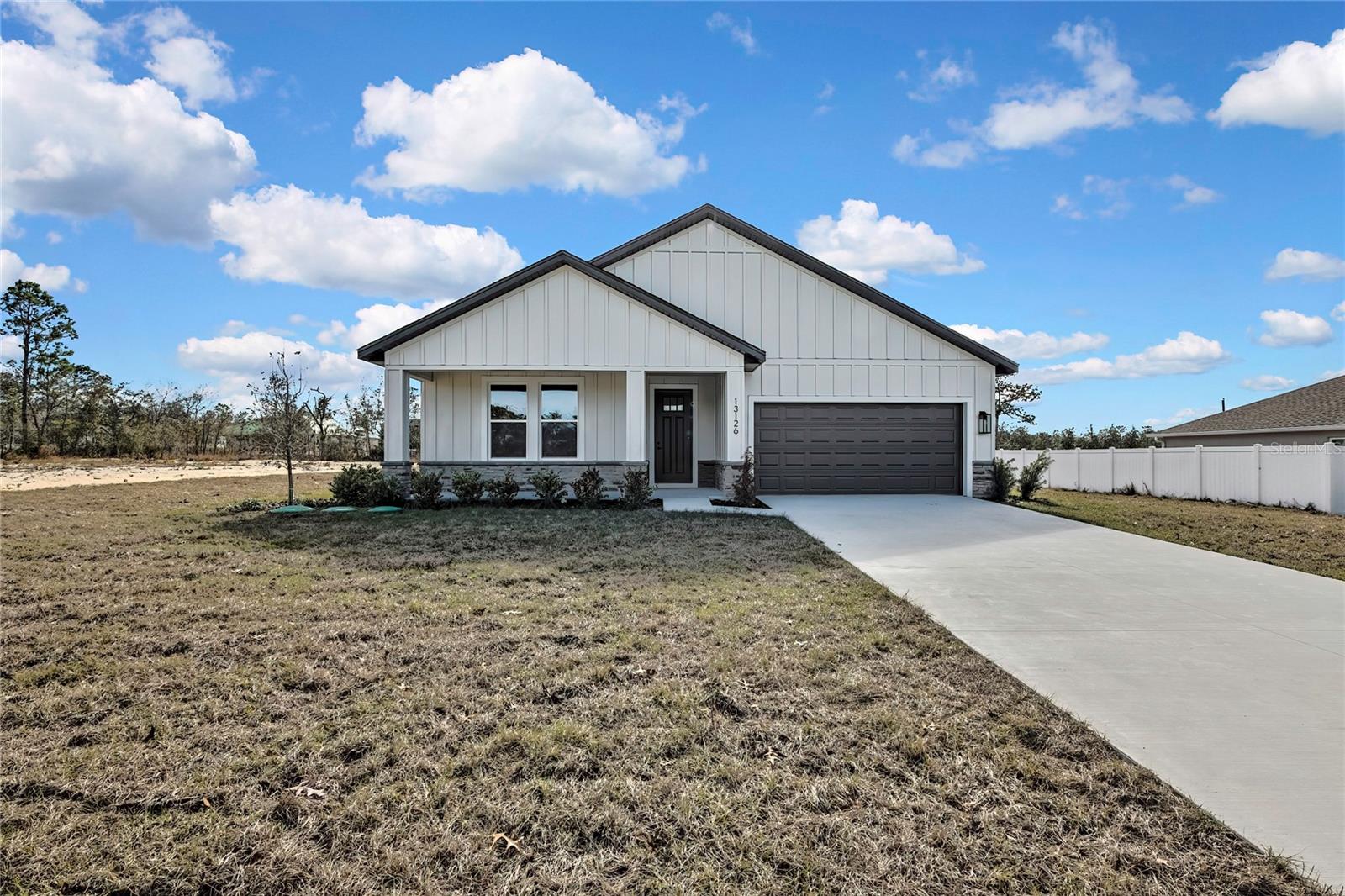Exceptional New Construction in the sought-after Weeki Wachee area! This stunning 4-bedroom, 3-bathroom residence showcases modern elegance, superior craftsmanship, and a thoughtfully designed open-concept layout that seamlessly blends style, comfort, and functionality.
From the moment you enter, you’ll be captivated by the soaring ceilings, abundant natural light, and sophisticated finishes throughout. The spacious living areas flow effortlessly into the gourmet kitchen, fully equipped with appliances, ample cabinetry, and an inviting design perfect for both entertaining and everyday living.
The luxurious primary suite offers a private retreat, while the additional bedrooms and bathrooms provide flexibility for family, guests, or a home office. Every detail has been carefully selected to create a warm and refined living experience.
Outside, the beautifully designed landscaping enhances the home’s impressive curb appeal, while the oversized 2-car garage adds convenience and storage. Nestled in one of Weeki Wachee most desirable locations, this exceptional property offers the perfect combination of privacy, tranquility, and accessibility.
A rare opportunity to own a beautifully crafted new construction home where quality, elegance, and modern living come together.
No HOA. No CDD. Move-in Ready