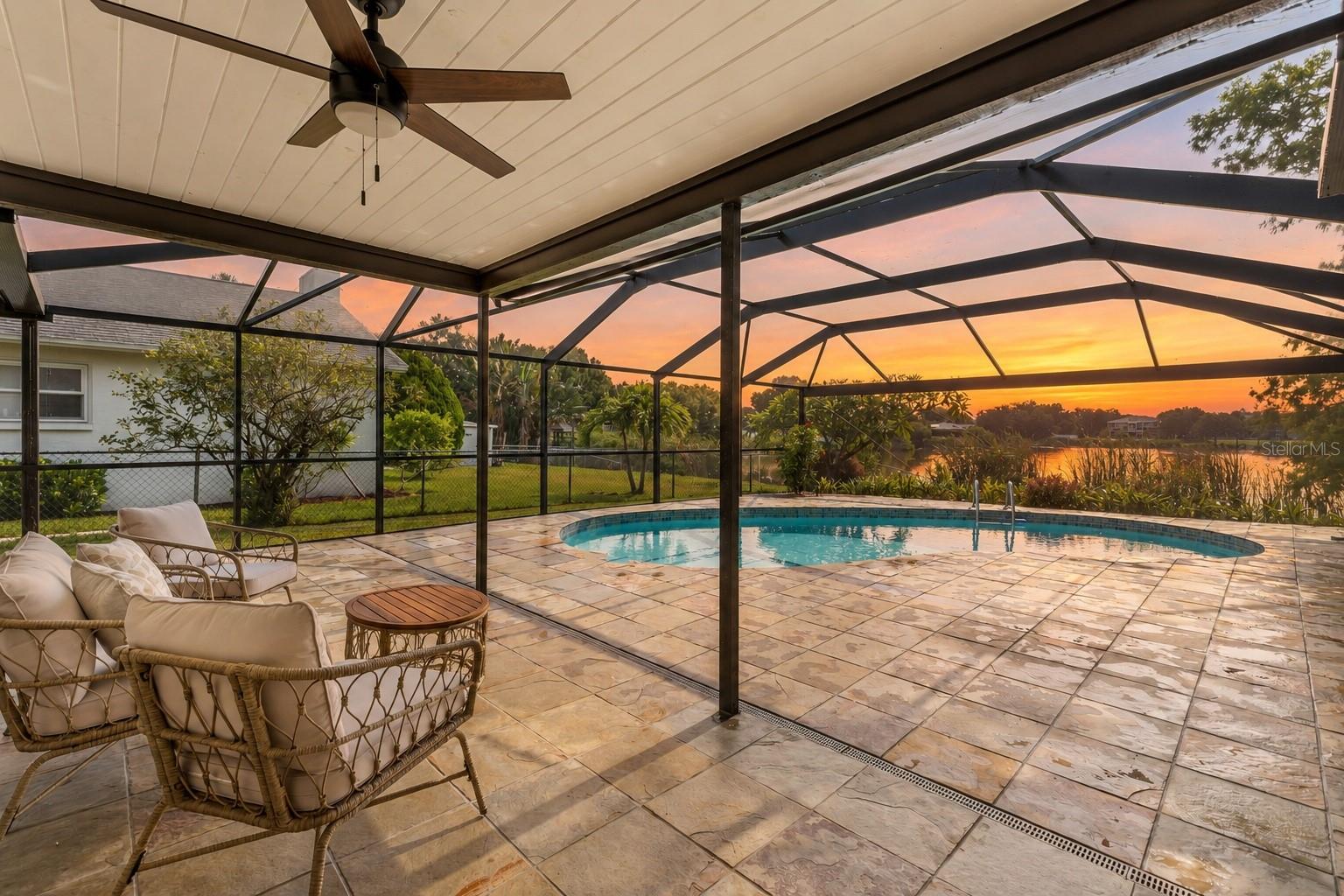 On the water in Largo. There's a rhythm to this one. Sunlight moves through open, flowing living spaces where every window opens onto Lake Allen — the water is always right there, in the kitchen, in the bedrooms, in that first cup of coffee. Step outside and your inground pool sits perched above the shoreline, so a swim comes with a lake view and the lake comes with a pool. And because this is a no gas motor lake, the water stays glassy and calm — just the soft kind of quiet you can actually feel.  This 3 Bedroom 2 Bathroom home is wrapped in lush, private greenery, framed by water on one side and a canopy of green on the other. Underneath it all: a brand-new roof — yes, the insurance conversation just got a whole lot easier. Kayak at sunrise, float the afternoon away, or simply watch the sky turn colors from your own stretch of Florida shoreline.  More to Come!