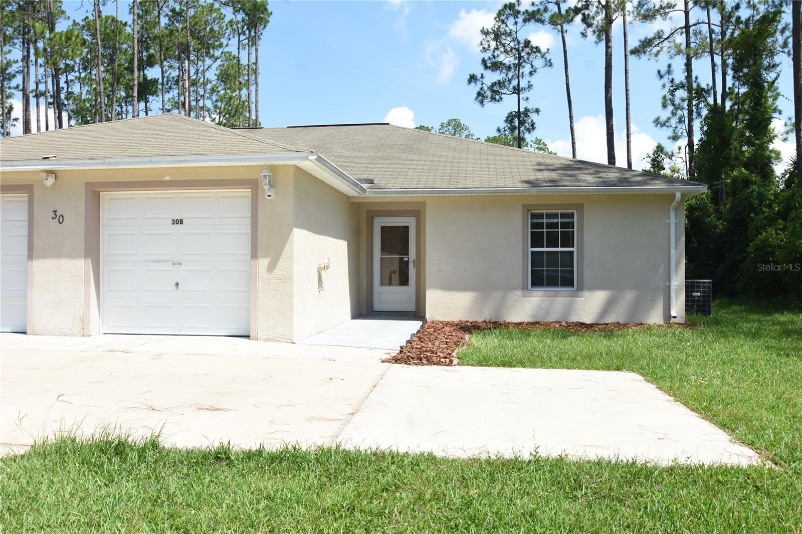 Dive into a world of comfort and convenience at 30 Eton Ln, Unit B, where this charming duplex awaits your arrival in the heart of Palm Coast, FL. With a generous 1,214 sq ft of well-designed living space, this three-bedroom home offers ample room to relax and entertain. The two full bathrooms ensure that your morning routine or evening unwind is nothing short of seamless and stress-free. Nestled in a vibrant community, this property combines modern living with a touch of tranquility, perfect for those who value both connection and privacy. Imagine yourself savoring the Florida sunshine in a home that offers both comfort and style in equal measure. Every corner of this duplex invites you to create unforgettable memories, from cozy family dinners to lively gatherings with friends. The open floor plan encourages a natural flow between spaces, making it easy to personalize your new home to suit your lifestyle. Located in a desirable area, you'll find yourself just a short distance from local amenities, adding convenience to your everyday life. Experience the best of Palm Coast living and make 30 Eton Ln, Unit B your new retreat today.