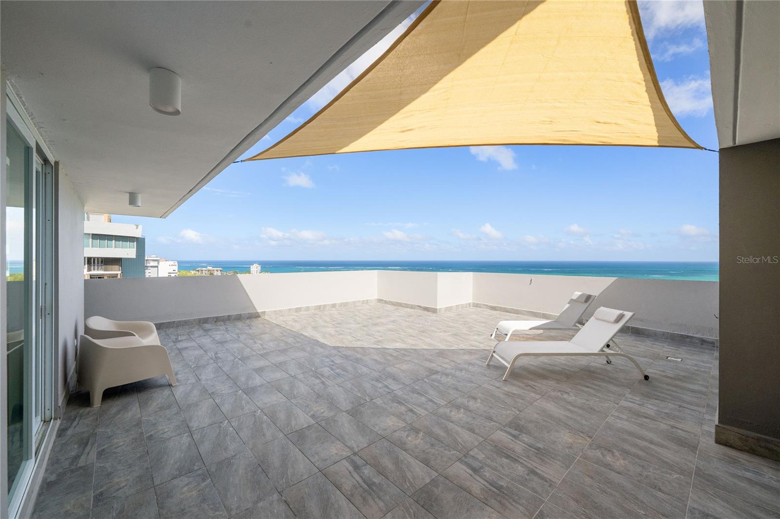 Welcome to PH-4 at Waldorf Tower! This exquisite penthouse offers a unique blend of luxury, comfort, and convenience. Situated on the top floor, this corner unit boasts breathtaking ocean and city views, providing a serene backdrop for your daily life.

Spanning 2,068 square feet, including 877.28 square feet of oversized terrace, this meticulously renovated property features two bedrooms and two modern bathrooms. The open-concept design enhances the sense of space and light, with neutral colors creating a clean and sleek aesthetic. The living area seamlessly flows into the terrace, perfect for entertaining or simply enjoying the stunning beachfront vistas.

Everything is new, the unit just underwent a complete renovation. The kitchen is equipped with brand new appliances, ensuring a contemporary cooking experience. As a beachfront penthouse, it provides direct access to the pristine sands of Isla Verde, renowned for its vibrant atmosphere and convenient location. The building has 24-hour security, a breach front pool, and a recently purchased full power generator pending installation. PH-4 also has 1 covered parking space.

This property is ideally situated in one of the best locations in Isla Verde, offering easy access to local amenities, dining, and entertainment options, while also being a short drive away from the international airport. Whether you are seeking a permanent residence or a vacation retreat, this penthouse delivers on all fronts.

Don't miss the opportunity to own a piece of paradise in one of the best beaches in the Metro Area. Contact us today to schedule a showing and experience this amazing penthouse!