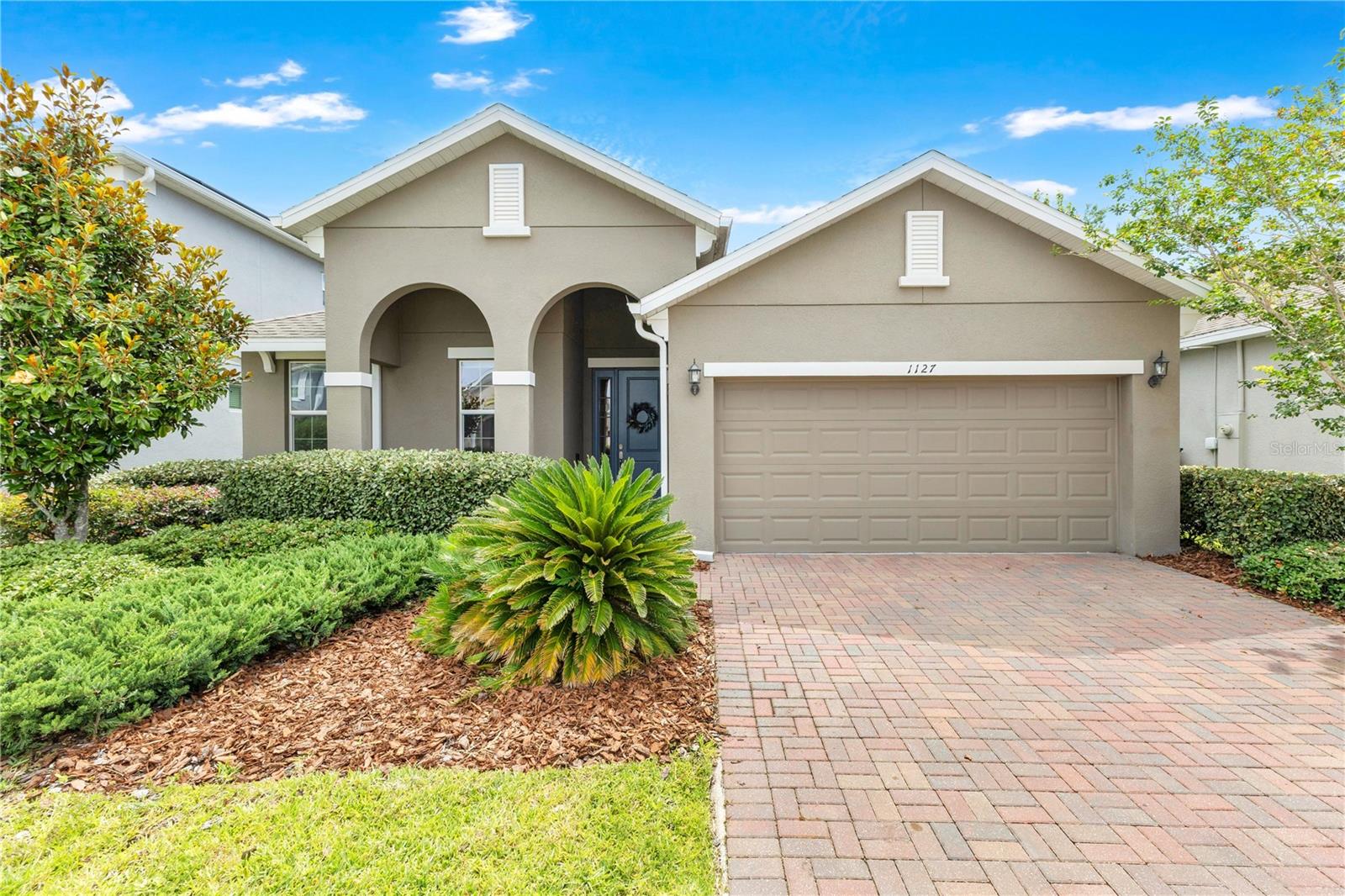 Welcome home to this beautifully maintained 3-bedroom, 2-bath residence offering modern style, open-concept living, and the peace of mind of fully paid-off solar panels at closing, providing long-term energy savings for the new owner. Built in 2020, this move-in-ready home features a spacious split-bedroom floor plan with neutral designer finishes, upgraded wood-look ceramic tile throughout the main living areas, and abundant natural light.
The heart of the home is the stunning kitchen, complete with shaker cabinetry, quartz countertops, stainless steel appliances, a farmhouse sink, and a large center island that overlooks the dining and family rooms—perfect for entertaining and everyday living. The spacious primary suite offers a tray ceiling, two generous walk-in closets, and an en-suite bath with dual vanities, quartz counters, and a beautifully tiled walk-in shower.
Step outside to enjoy the extended brick paver patio and fully fenced backyard, creating an ideal space for outdoor dining, pets, play, or simply relaxing in privacy. Additional features include recessed lighting, modern fixtures, indoor laundry with abundant storage, a two-car garage, and energy-efficient construction.
Conveniently located near major highways, shopping, dining, Orlando International Airport, UCF, Valencia College, and downtown Orlando, this home offers the perfect combination of comfort, style, and location. With solar panels being paid off by the seller, this exceptional property delivers both immediate enjoyment and future savings. Don't miss your opportunity to make this beautiful home yours!
