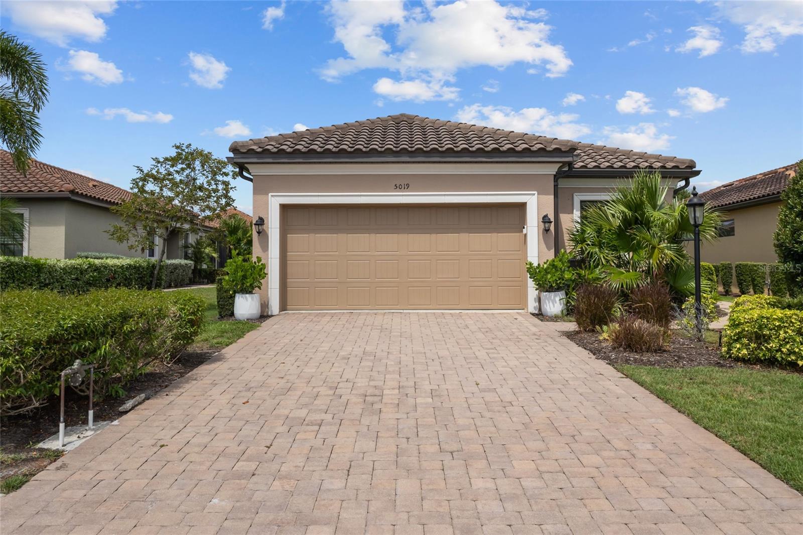 Welcome to resort-style living in the highly sought-after Esplanade community! This immaculate three-bedroom, two-bath pool home is sure to impress with its open floor plan, quality finishes, and exceptional privacy. Designed for both everyday living and entertaining, the spacious kitchen features abundant counter space, all gas appliances including a gas stub on the lanai makes outdoor grilling a breeze. The living area has tray ceilings and crown molding. The beautiful primary suite offers a peaceful retreat with an oversized walk-in closet and a luxurious ensuite bathroom. The split-bedroom floor plan includes a convenient Jack-and-Jill bath, providing comfort and privacy for family and guests. Luxury flooring in the wet areas and carpet in the bedrooms. Step outside to your own tropical oasis featuring a private screened pool and lanai with a waterfall pool perfect for relaxing or entertaining year-round. Esplanade offers an unmatched lifestyle with world-class amenities, including a resort-style pool, resistance pool, lap pool, tennis and pickleball courts, two fitness centers, two clubhouses, exercise classes, a full-service spa offering hair, nail, and massage services, and a beautiful championship golf course with pay-to-play access. With so much to enjoy right within the community, you'll truly feel like you're on vacation every day. This is Florida living at its finest!. Lakewood Ranch is the #1 Master plan community in the US. Just minutes to Waterside, the worlds most beautiful beaches, 100s of restaurants, and lots of shopping.