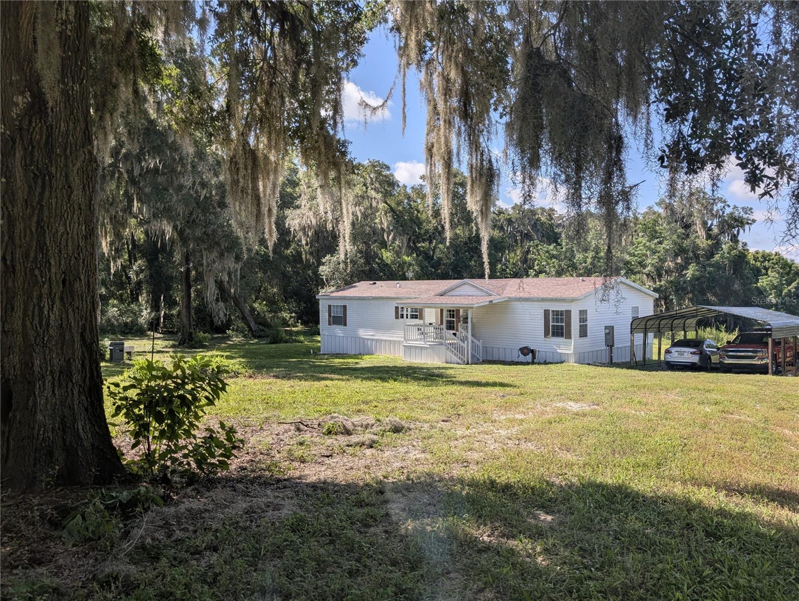 You'll fall in love with this very well maintained 3bd/2ba home on 5.16 completely fenced acres. No HOA! Zoned AG so bring your horses, cows, chickens, goats and start living the country life. There are chicken coops on the property and with over 5 acres room for all of your toys! Beautiful oak trees are just some of what adorn the property. Entering the home you walk into the spacious living room with a coat closet. The sizeable kitchen has a breakfast bar, new stainless steel appliances, a closet pantry and an island with drawers and cabinets for storage. The primary bedroom has a huge walk-in closet an en-suite bath with double sinks and a garden tub. The open floor plan is great for entertaining and the split plan for the bedrooms gives everyone a little privacy. This home is CASH ONLY! The Cube and Aza Health are at the beginning of Amos Rd on Union Ave. Crescent City Jr/Sr High School is only 1.1 mile away and the new Middleton-Burney Elementary School is only 2.5 miles way. Home is only minutes from Crescent Lake, Lake Stella, public boat ramps, parks, restaurants and stores. An hour or less to DeLand, Ormond Beach, "World Famous" Daytona Beach, "Historic" St. Augustine and St. Augustine Beach. Less than an hour and a half to Gainesville, Jackonville and Orlando.
