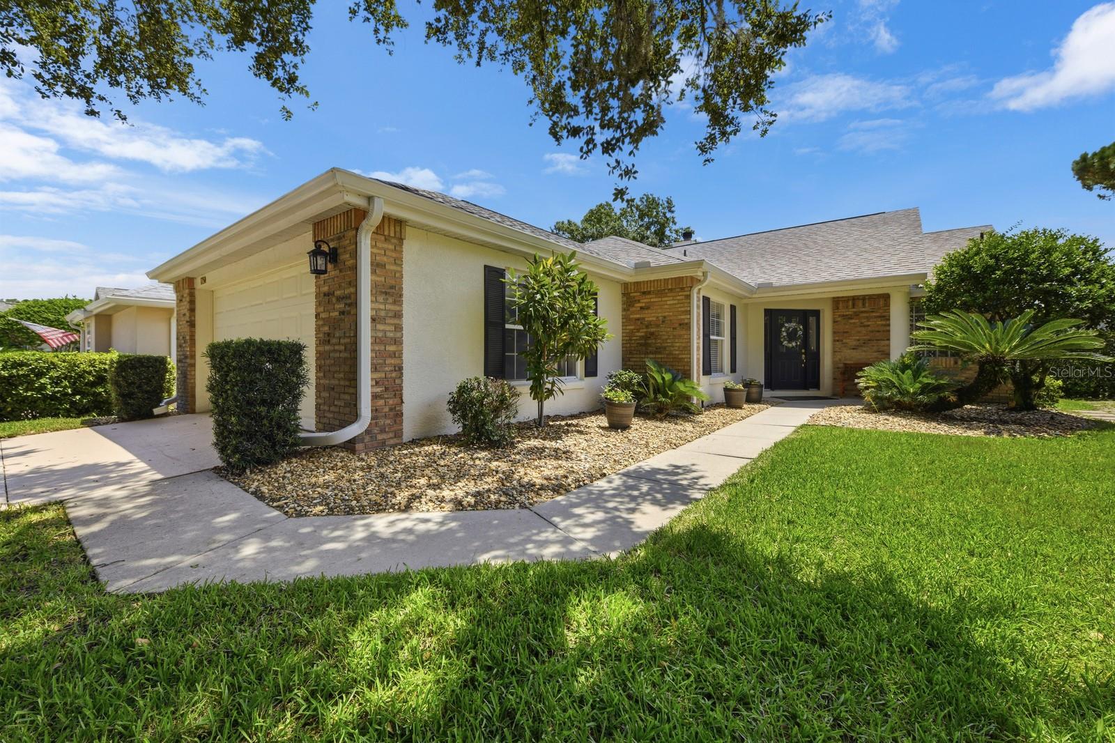 Move-In Ready Golf Course Living with Pond Views in the Country Club of Mount Dora
Move right in and enjoy easy Florida living! Beautifully refurbished in late 2021, this home offers peace of mind with a new roof, fascia, gutters, soffits, interior and exterior paint, luxury vinyl plank flooring, updated bathrooms, stainless steel kitchen appliances, and a new screened lanai cage. Most furnishings are negotiable, making your transition even easier.  Located on picturesque, tree-lined Stafford Springs Blvd. in the sought-after Country Club of Mount Dora, this home overlooks both the golf course and a peaceful pond. Relax on the welcoming covered front porch, or enjoy the expansive 12' x 40' screened lanai with covered seating—perfect for entertaining, reading, or simply soaking in the tranquil views.  The Homeowners Association's Uniform Yard Management program professionally maintains the lawn, allowing you to enjoy a carefree, low-maintenance lifestyle.  Inside, the spacious foyer opens to a light-filled living room featuring a wood-burning fireplace and beautiful golf course views. The split-bedroom floor plan offers privacy for owners and guests. The primary suite features sliding glass doors to the lanai, a generous walk-in closet, and an en-suite bath with double vanities, a garden tub, and a walk-in shower. The guest bedroom is conveniently located next to a full bath.  The dining area connects seamlessly to both the living room and kitchen, creating an open, light-filled space for everyday meals or entertaining.  The kitchen includes stainless steel appliances, a pantry, and an adjacent laundry area with washer and dryer.  Life at the Country Club of Mount Dora offers as much activity—or relaxation—as you choose. Optional membership is available for golf, tennis, pickleball, swimming, and social activities. The clubhouse offers public dining and a full calendar of community events, and the neighborhood is golf cart friendly, making it easy to visit friends, enjoy the clubhouse, or simply take a leisurely ride through this beautiful community.  Just minutes away, historic downtown Mount Dora offers charming boutiques, antique shops, waterfront parks, acclaimed restaurants, and year-round festivals. Nearby natural springs, the Wekiva Trail, and renowned bass fishing provide abundance of outdoor recreation, while Orlando International Airport is only about 45 minutes away.  Whether you're looking to downsize, retire in style, or enjoy a seasonal retreat, this beautifully updated home offers the perfect combination of comfort, convenience, scenic views, and the relaxed lifestyle that makes the Country Club of Mount Dora one of Central Florida's most desirable communities.