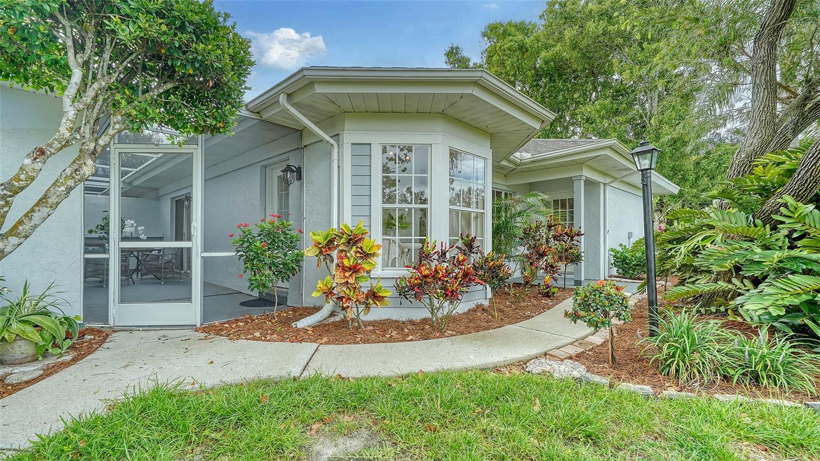 Welcome to 6467 Carrington Circle, Unit 43, nestled in the serene and highly sought-after 55+ community of Westwoods at Sunrise. This charming 2-bedroom, 2-bath condo offers 1,388 square feet of thoughtfully designed, maintenance-free living in a tranquil cul-de-sac setting.

Step inside to discover a bright and airy open-concept floor plan with soaring ceilings and beautiful new tile flooring throughout. The custom kitchen, completely updated with new cabinets, butcher block countertops, and stainless steel appliances, features a cozy breakfast nook perfect for your morning coffee. The spacious primary ensuite boasts dual sinks, a walk-in shower, and sliding glass doors leading to an enclosed lanai where you can relax and soak in the serene Florida ambience.

Recent updates include a new AC system (October 2024) and a new roof (2019). The meticulously maintained attached garage includes laundry facilities, while updated landscaping with native flora adds to the peaceful appeal.

Westwoods offers a host of amenities, including two heated community pools, a clubhouse, shuffleboard, pickleball, tennis courts, and common outdoor spaces perfect for gathering or relaxing. Conveniently located near I-75, Siesta Key Beach, Downtown Sarasota, and top-tier shopping, dining, and medical facilities, this home offers the perfect blend of convenience and tranquility. Pets welcome (with restrictions).

Schedule your private showing today and make this delightful condo your new sanctuary!